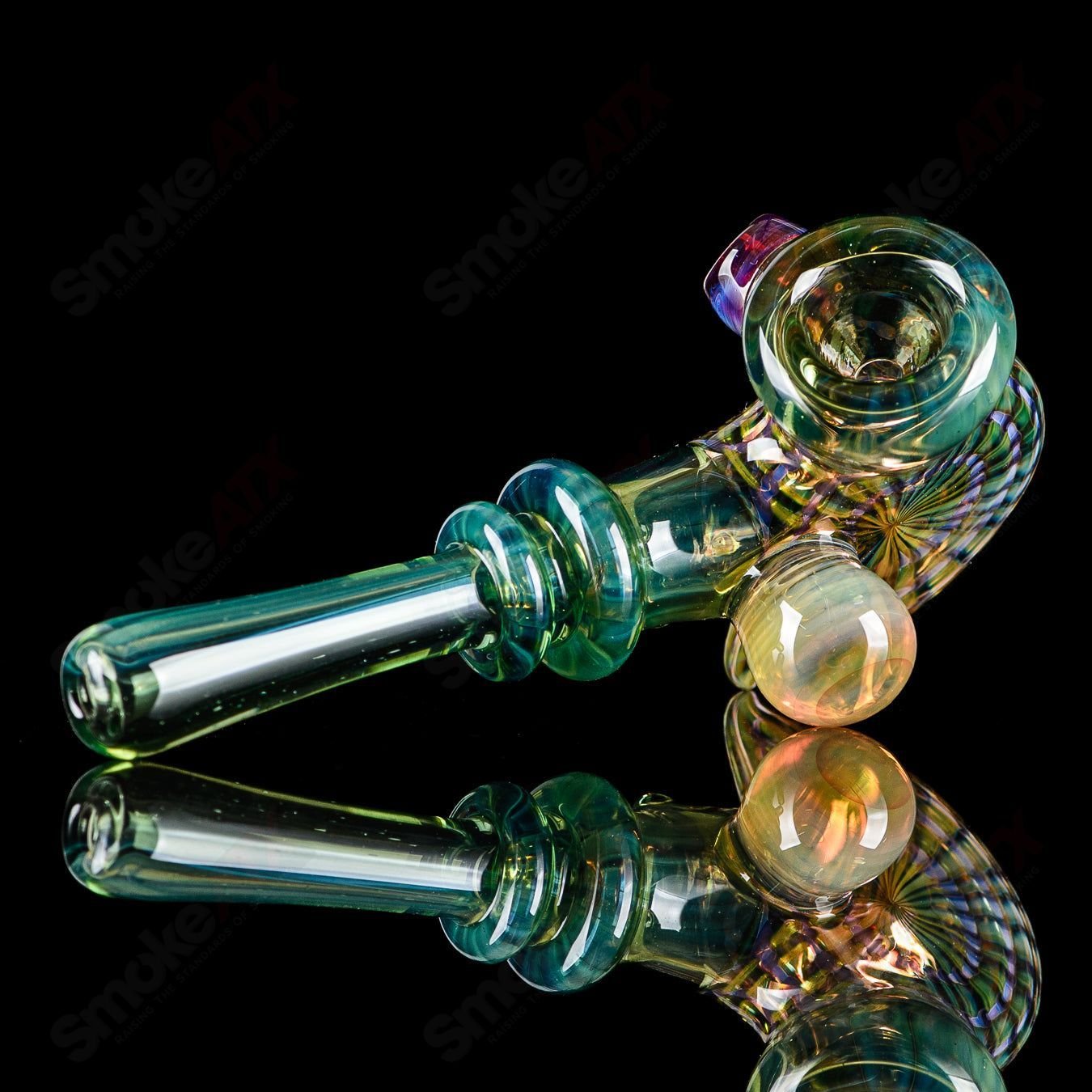 Dosh Glass Phantom Spoon Basic hand pipe with clear glass and unique design, featuring a rounded bowl and smooth mouthpiece.