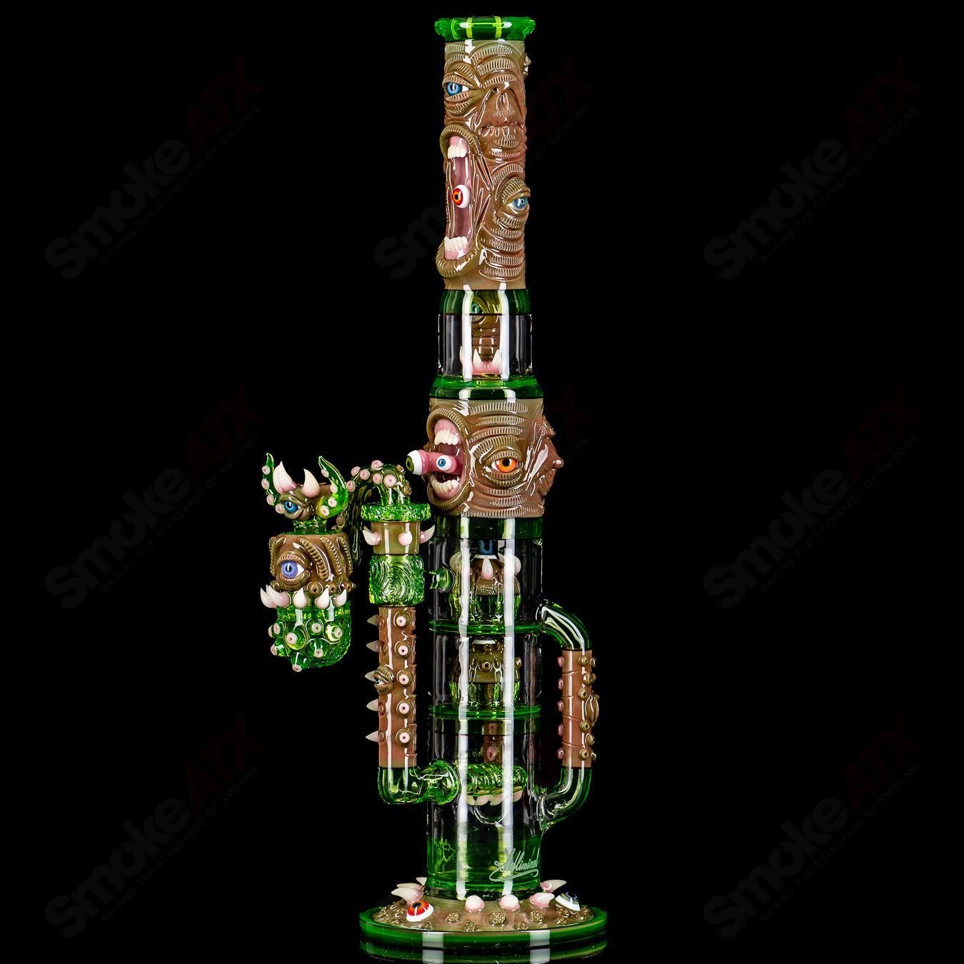 Heady glass waterpipe called Subliminal X Salt with intricate design, featuring a clear glass body and colorful accents.