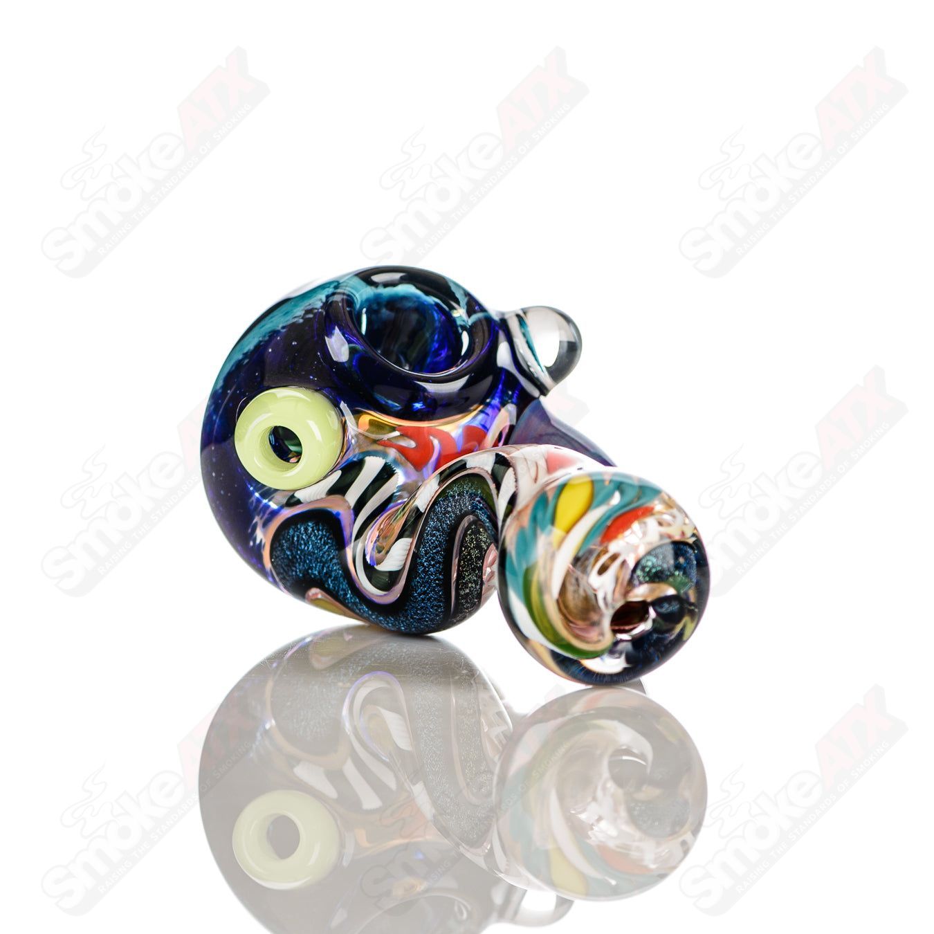 Color worked IO spoon pipe by Jeremy from Oregon, hand-blown heady glass with vibrant 31-color design and intricate details.