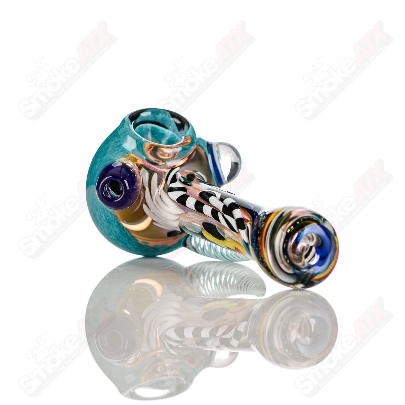 Color worked IO spoon pipe by Jeremy from Oregon, handcrafted heady glass hand pipe with vibrant multi-color design.