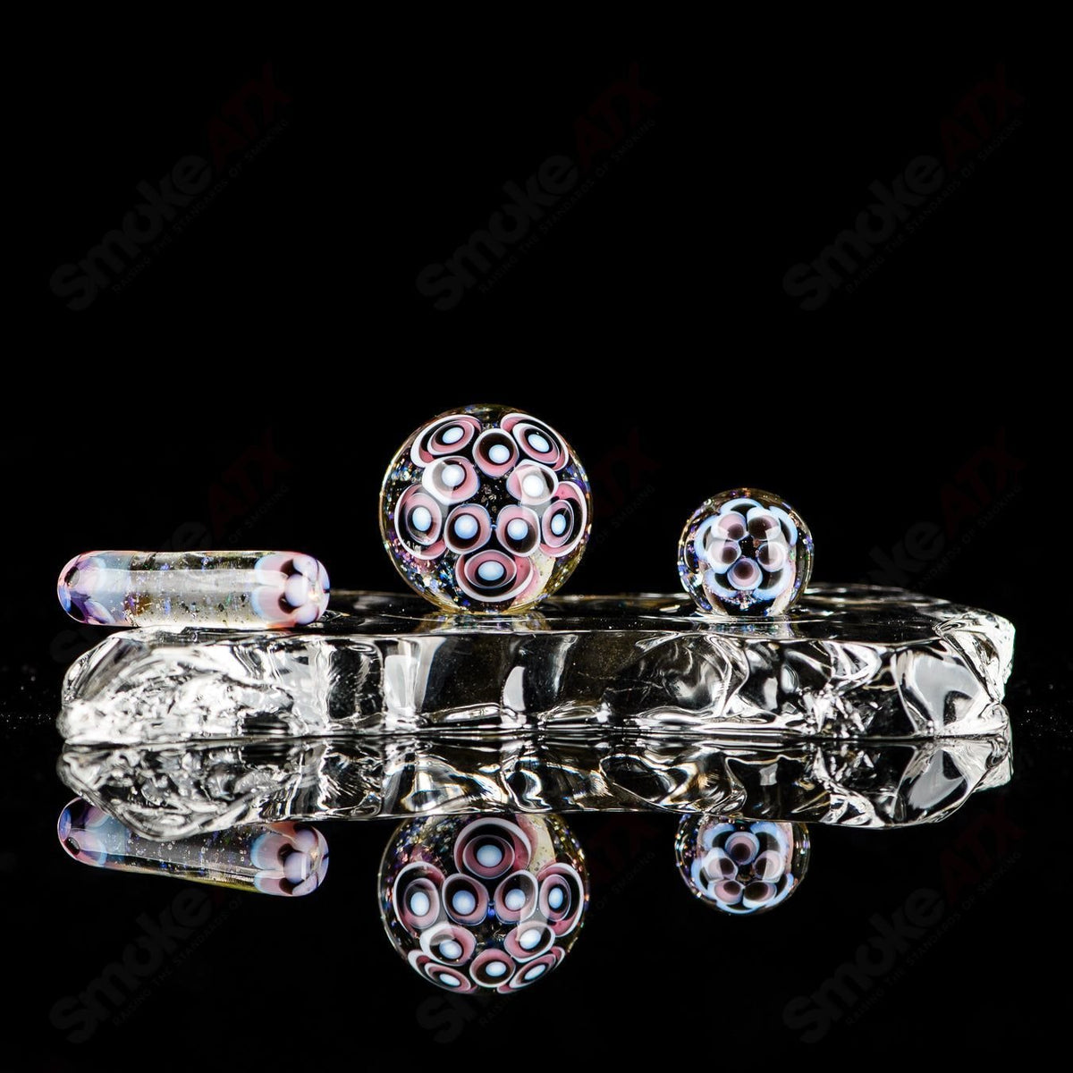 Three-piece UV Dotstack Cropal glass slurper set by Indo Glass with gold, ruby, citrine, Lucy, galaxy, and lotus designs.