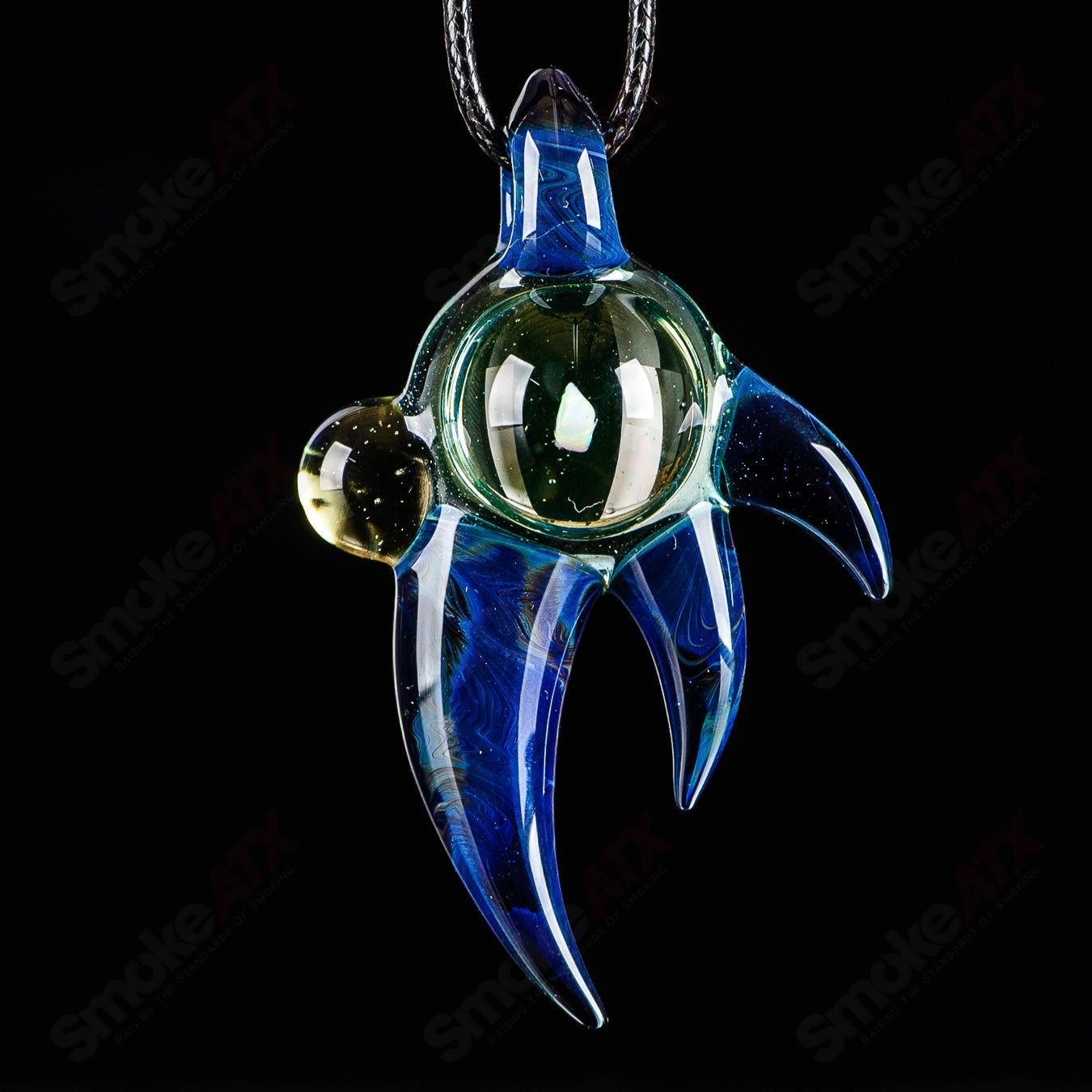 Dosh Glass #4 Amulet Pendant made of Dosh Glass, featuring intricate designs and vibrant glasswork, hanging as a decorative pendant.