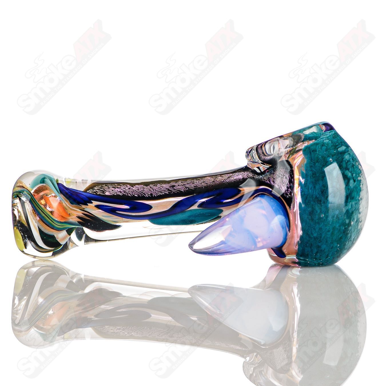 Colorfully worked IO spoon hand pipe by Jeremy from Oregon, featuring vibrant 4-color design and smooth glass detailing.