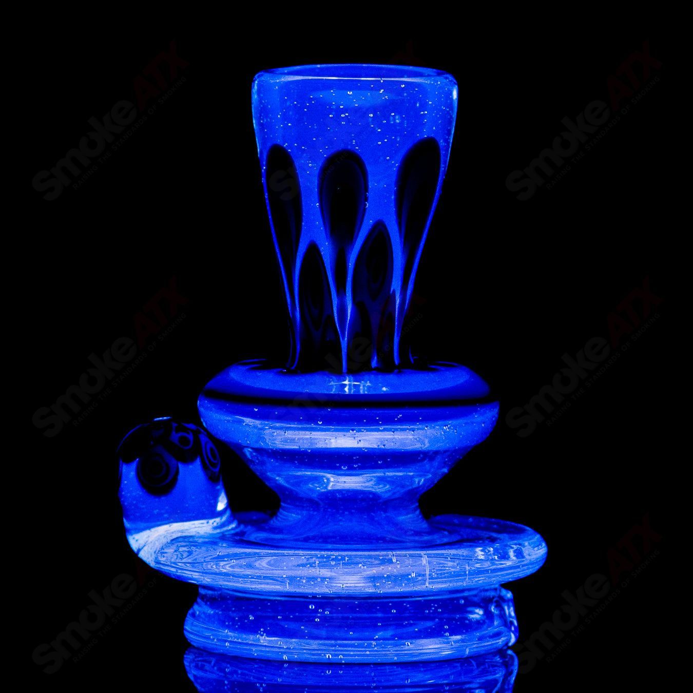 Heady glass Puffco Top with UV dot stack design for Indo X by Geoff Made Glass, showcasing vibrant colors and intricate glasswork.