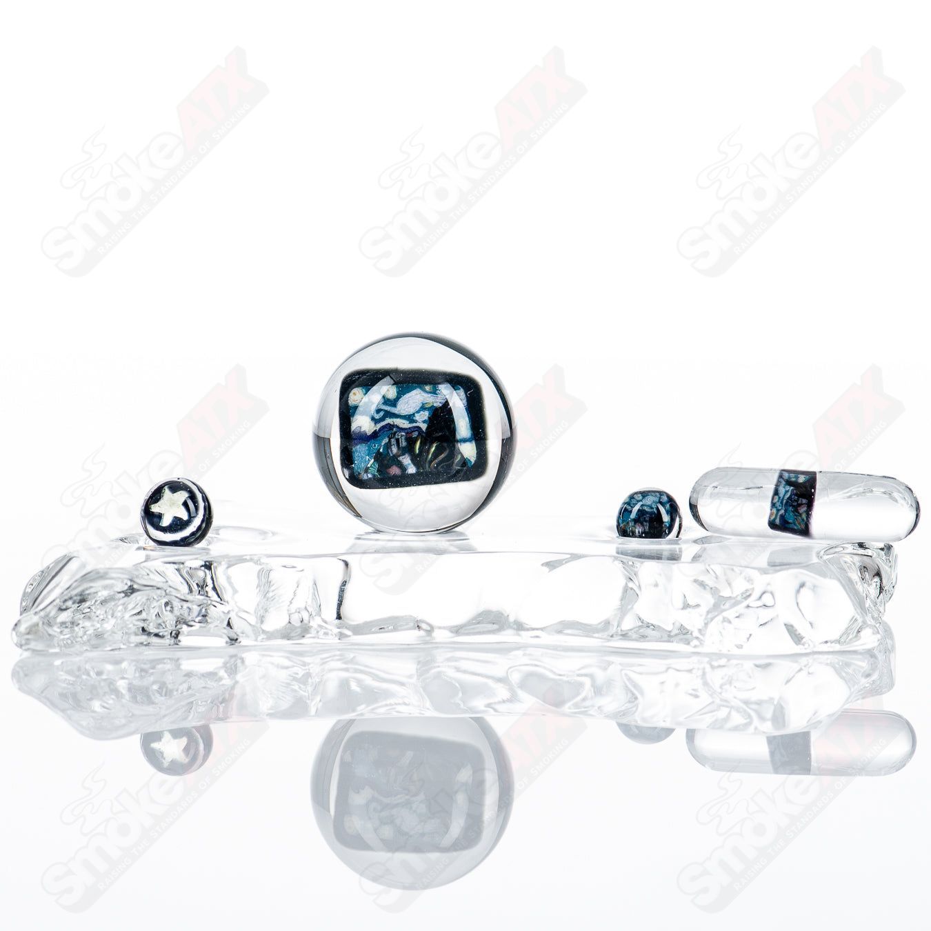 Four-piece Starry Night Slurper set by Grimm Glass featuring colorful, artistic glass pieces for drinking or display.
