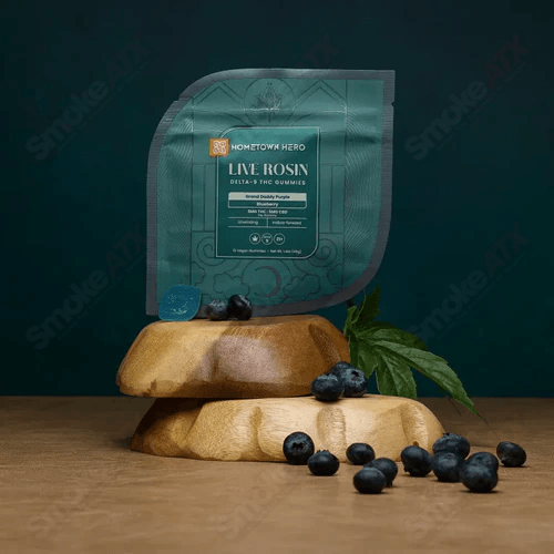Blueberry-flavored Hometown Hero hemp edibles with 5mg D9 THC and CBD gummies, featuring blue packaging and gummy shapes.