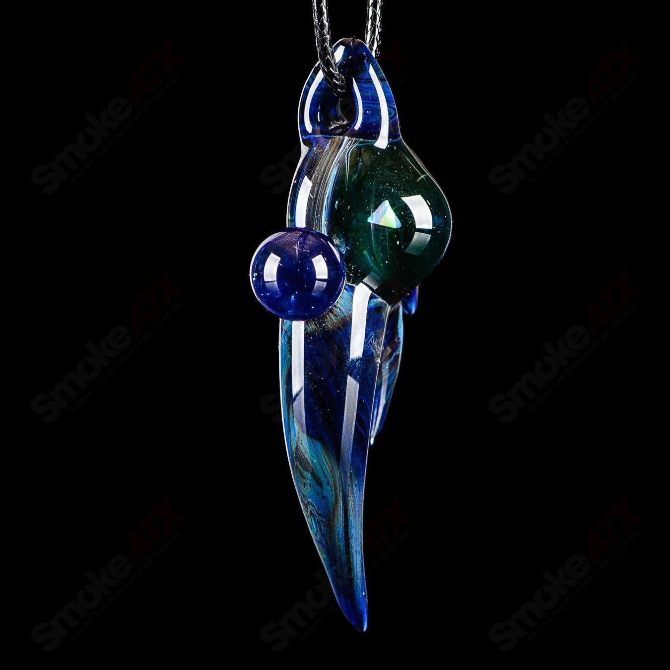 Dosh Glass #6 Amulet Pendant made of colorful Dosh Glass, featuring intricate heady glass design and a small amulet shape.