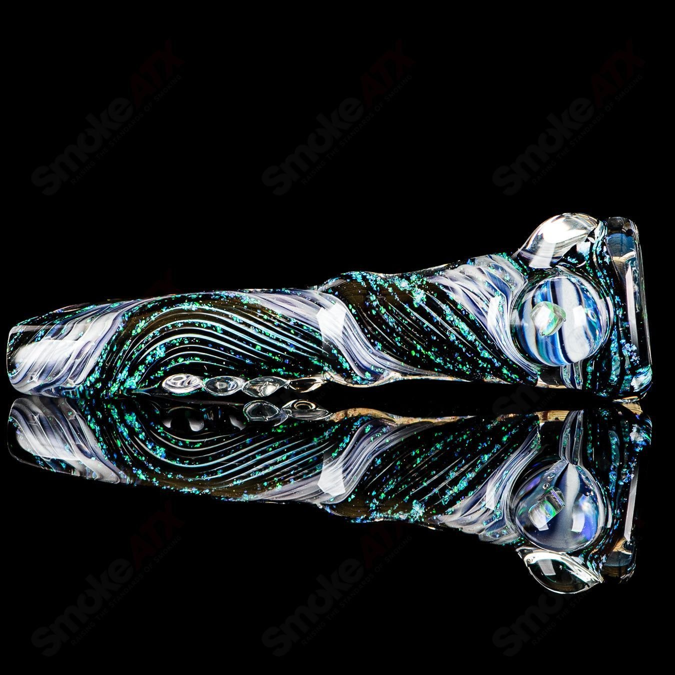 Glass chillum with colorful opal design by Rotational Science, showcasing its smooth, rounded shape and vibrant glass artistry.