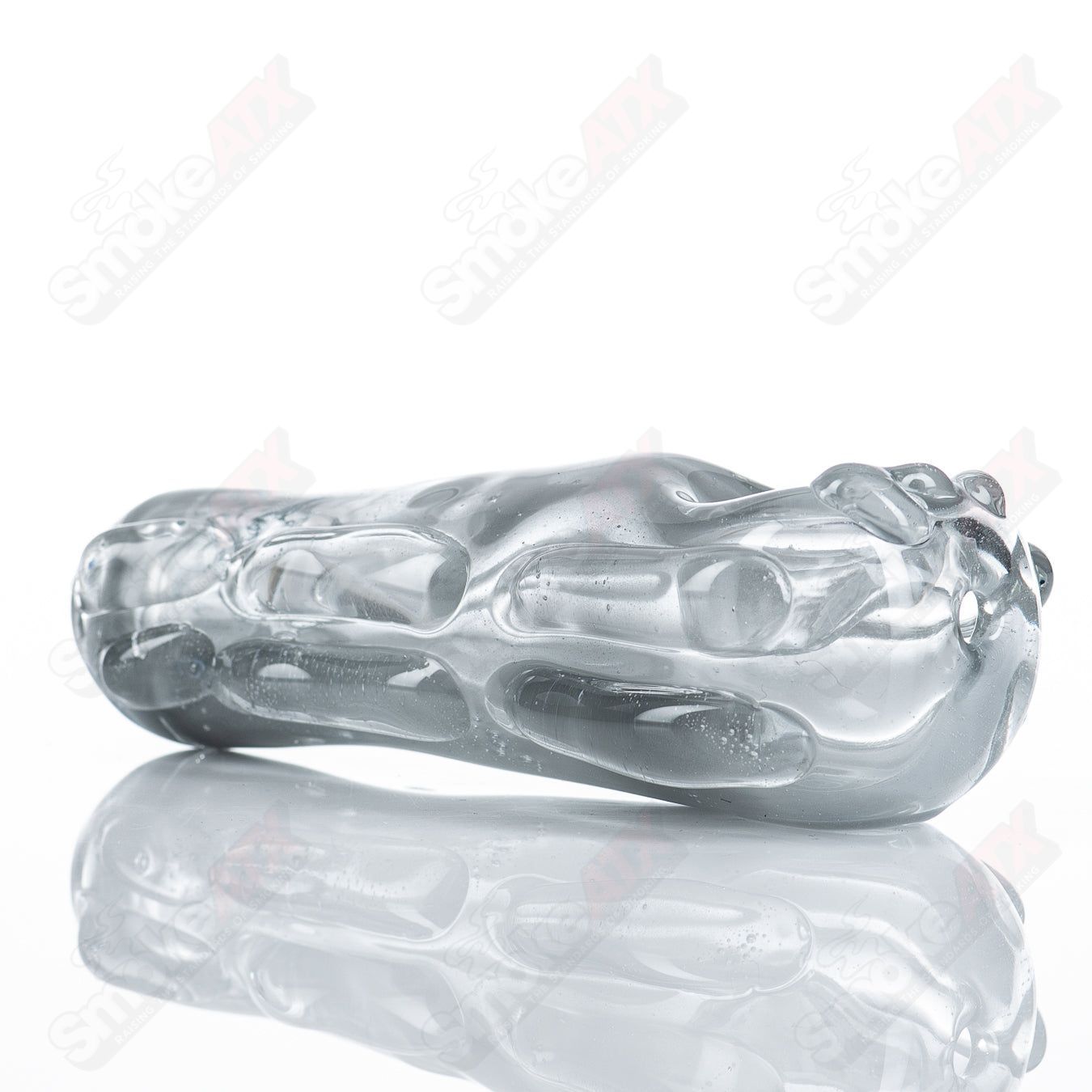 Glass pipe named Spoon Glass by Nobody, clear glass with a rounded bowl and straight stem, designed for smoking purposes.