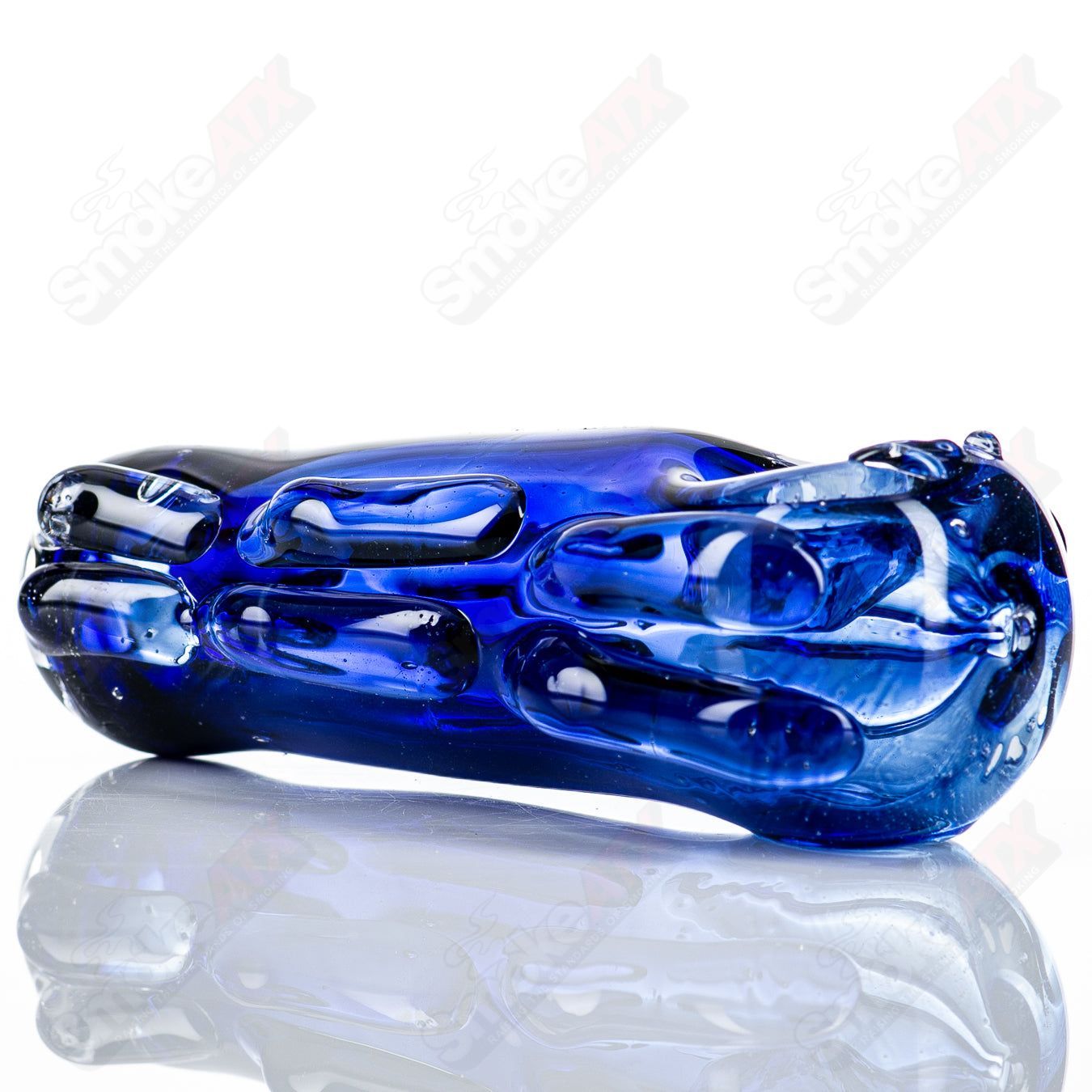 Clear glass spoon pipe by Nobody with a smooth, rounded bowl and straight stem, designed for smoking use.
