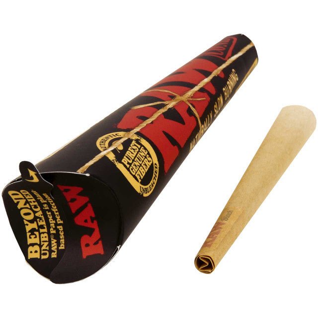 Six RAW 1 1/4 black rolling cones for smoking, made from natural unbleached paper, shown stacked in a 6-pack.