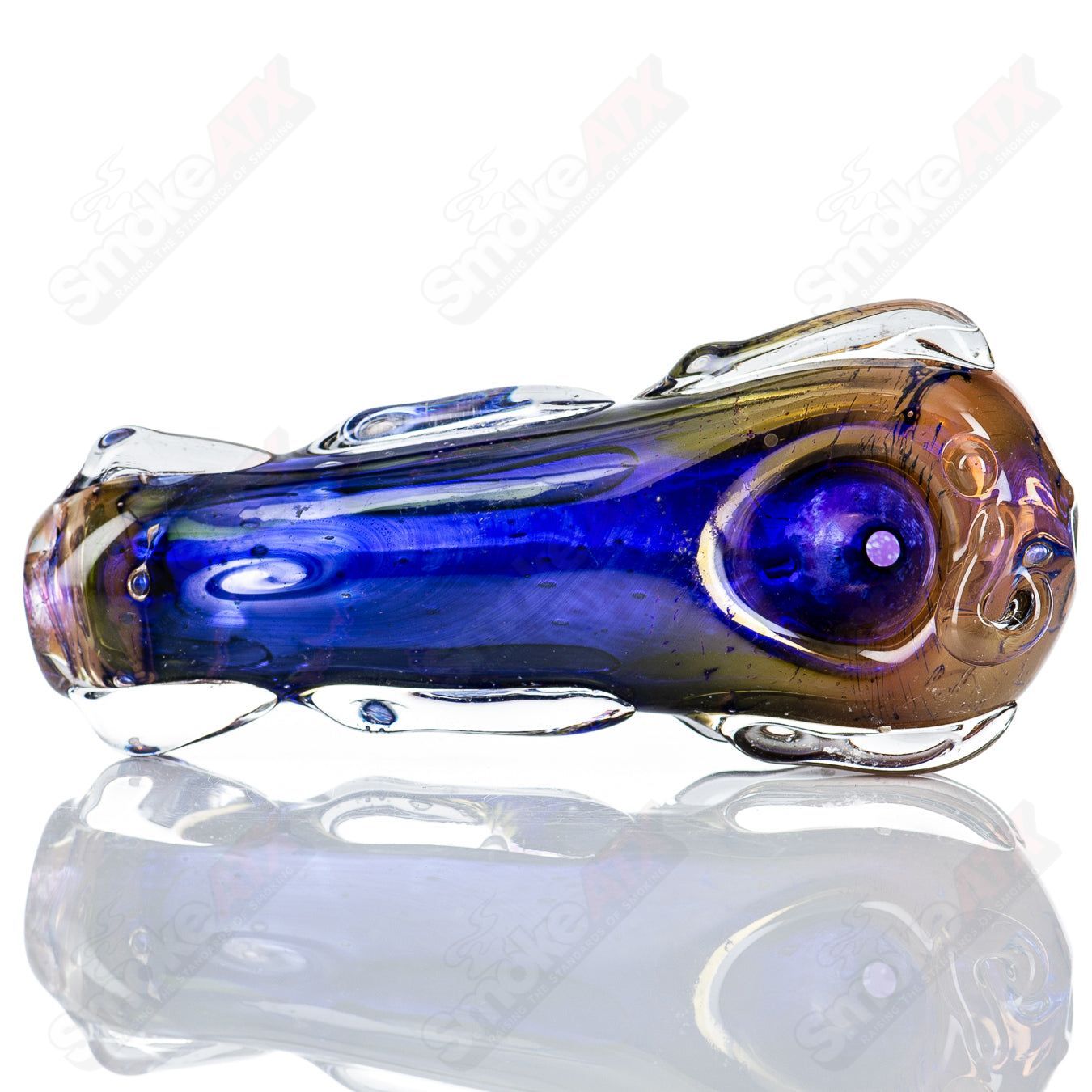 Glass pipe called Spoon Glass by Nobody with clear glass bowl and stem, designed for smoking, featuring a sleek, rounded shape.