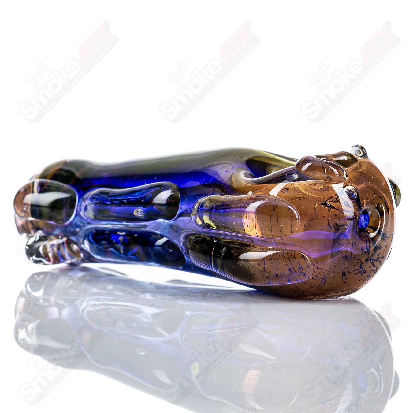 Glass pipe called #74 Spoon by Nobody, clear glass with a smooth, rounded bowl and elongated stem for smoking.