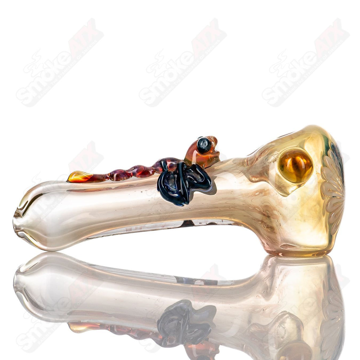 Glass #8 Critter Spoon hand pipe by Molten Imagination featuring a colorful critter design, transparent glass body.