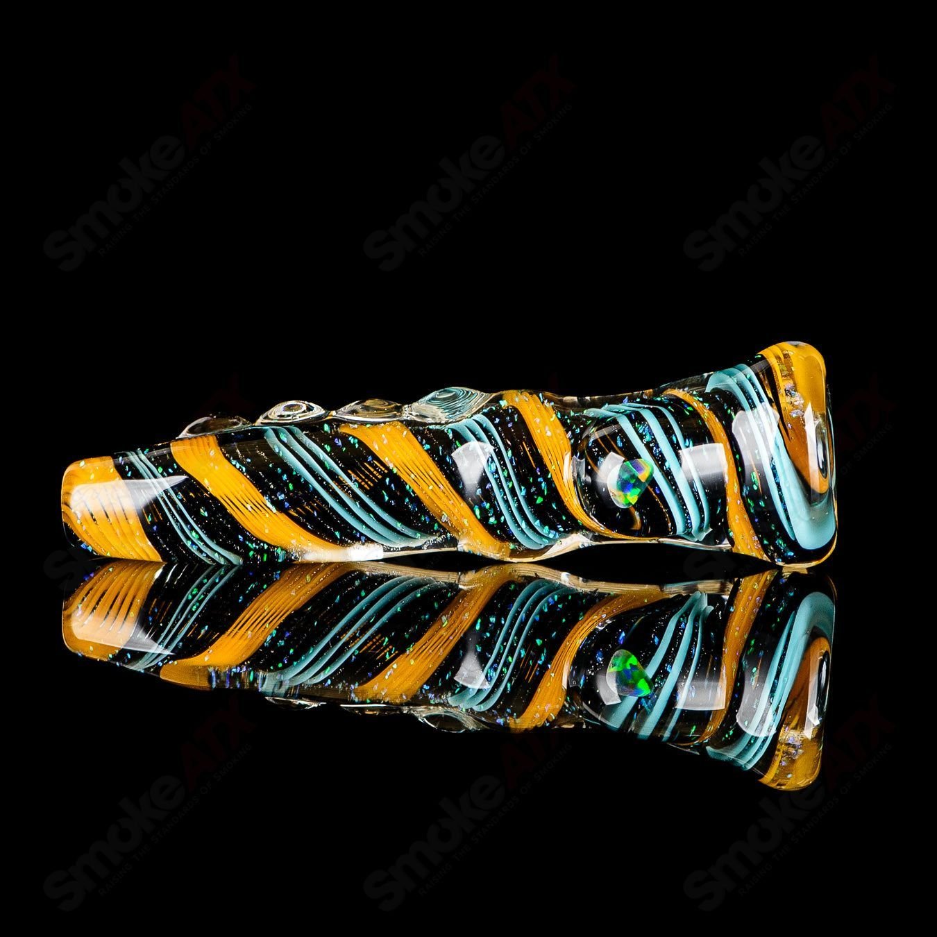 Glass chillum with colorful opal design from Rotational Science, featuring a sleek, cylindrical shape for smooth smoking experience.