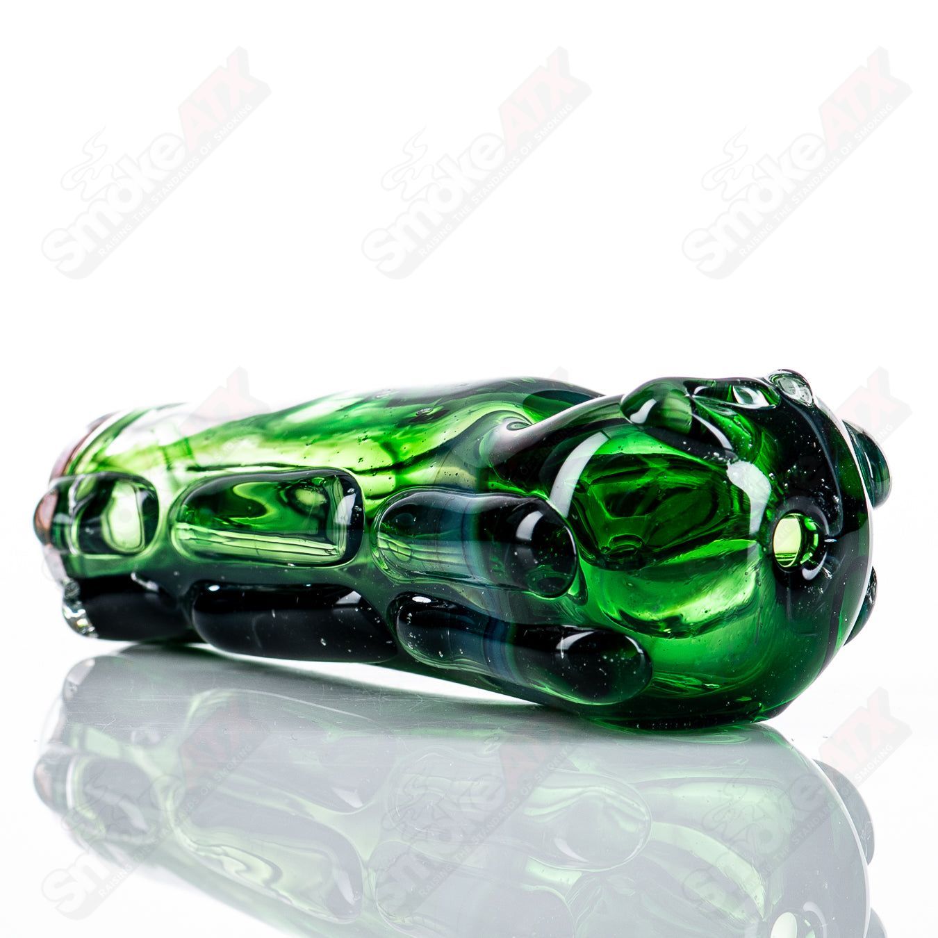 Glass spoon pipe by Nobody, clear glass smoking pipe with a rounded bowl and elongated stem for easy handling.