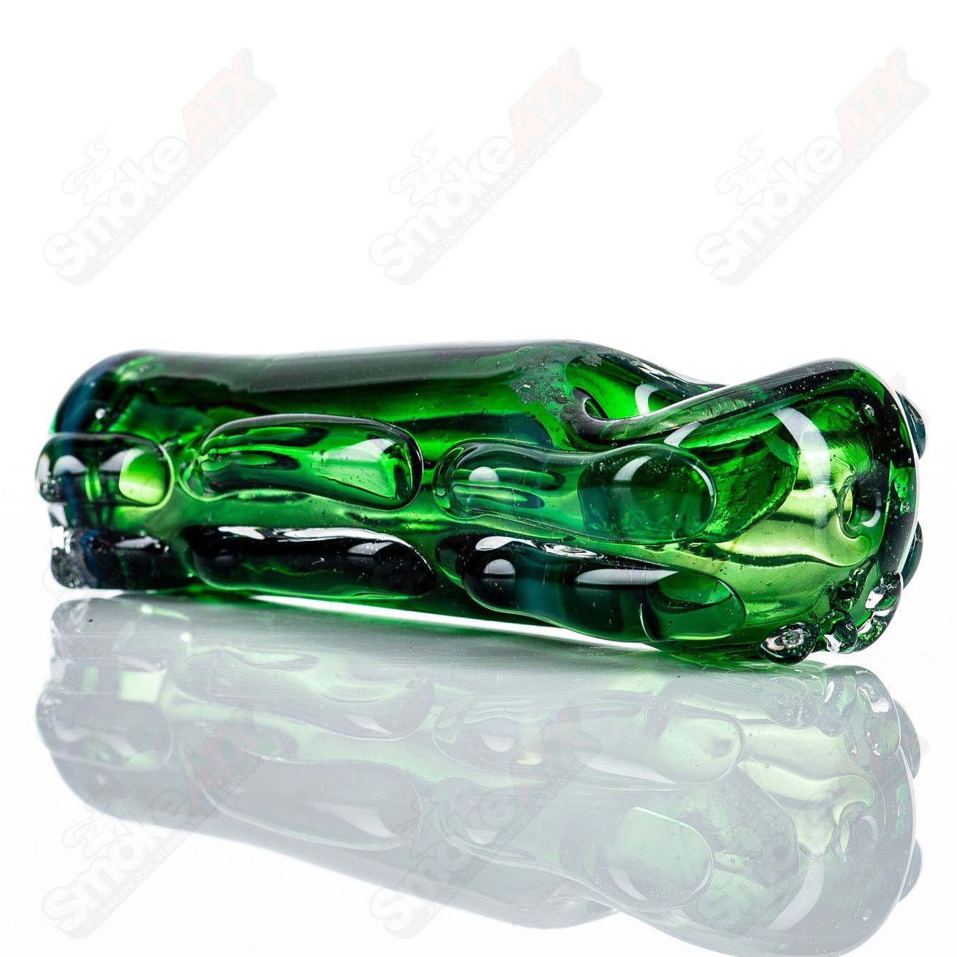 Clear glass spoon pipe by Nobody, featuring a smooth, rounded bowl and elongated stem, designed for easy handling and use.