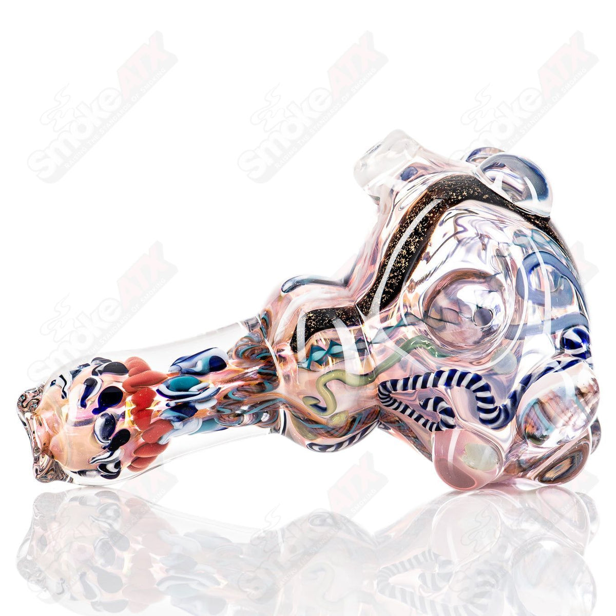 Molten Imagination Custom Glass Creations ISO Chaos Hammer Spoon, vibrant multicolored glass with intricate design detail.