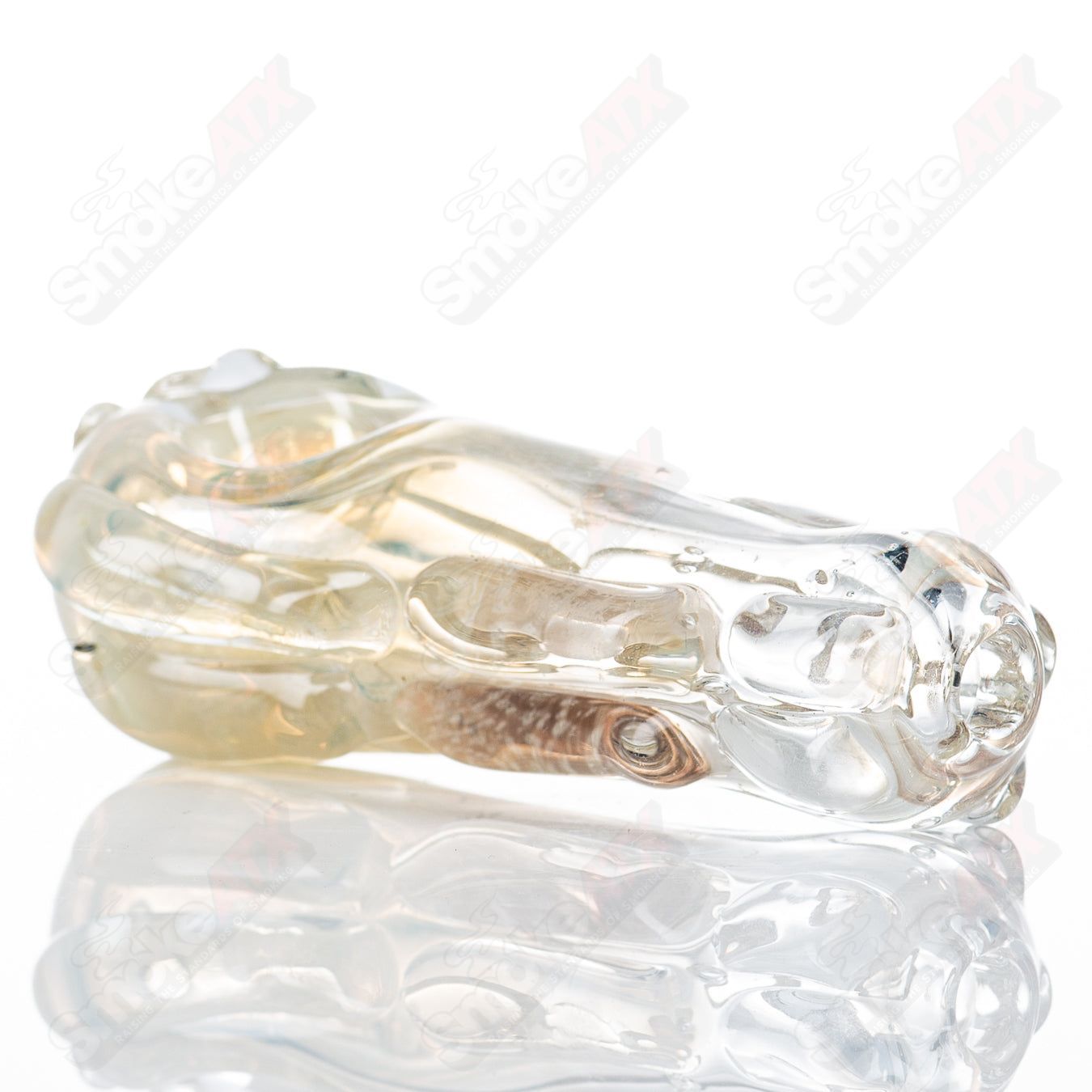 Glass pipe called Spoon Glass by Nobody with a smooth, curved design, made of clear glass, designed for smoking use.