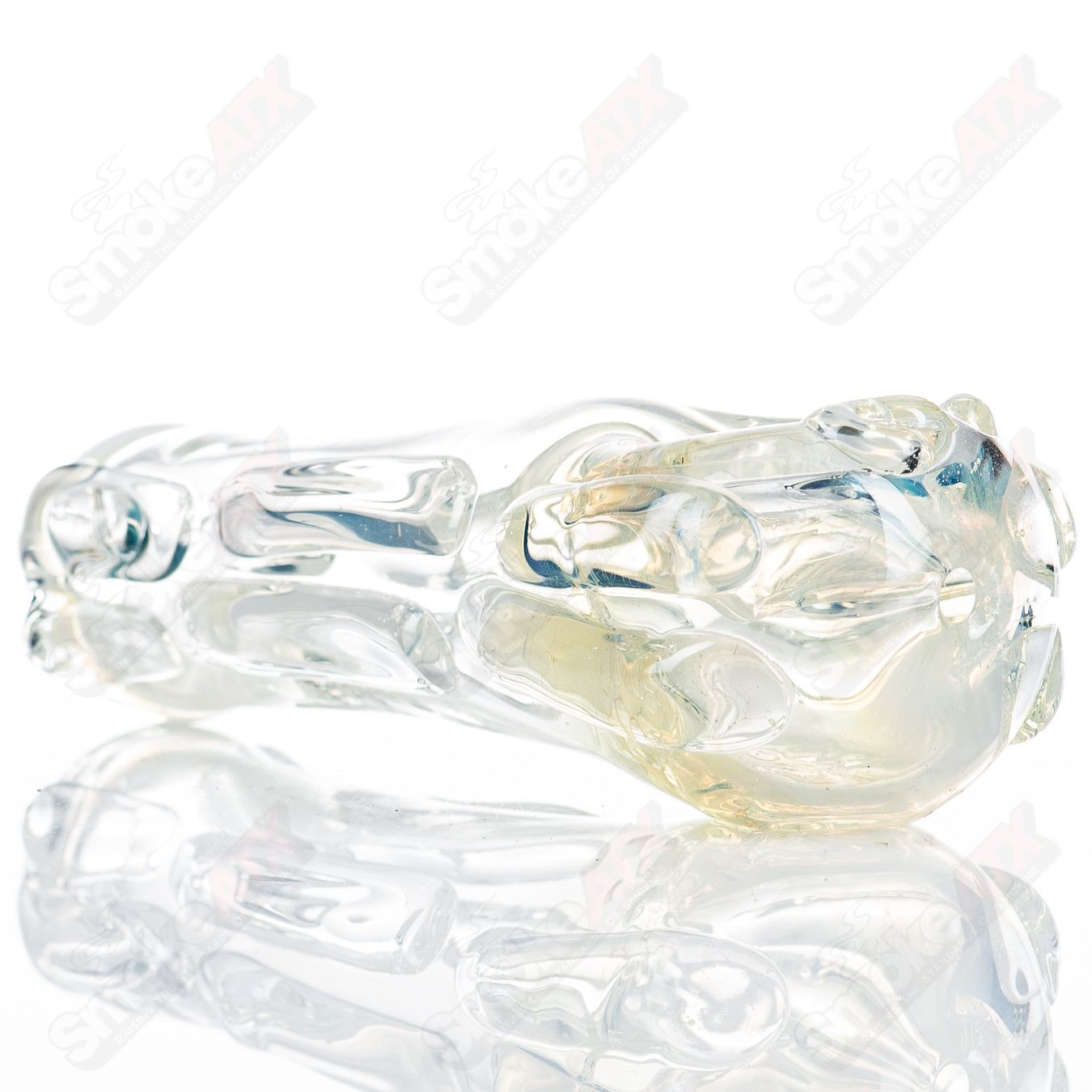 Glass pipe called Spoon Glass by Nobody, showing a clear, smooth glass pipe with a rounded bowl and elongated stem design.