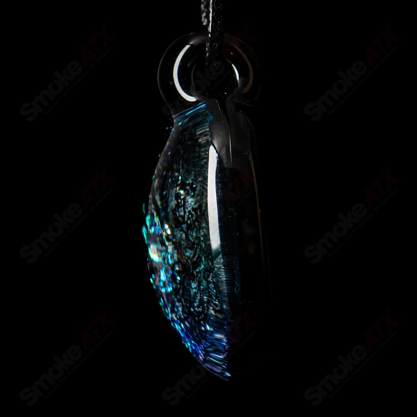 Colorful 1.5-inch Dichroic Turtle Pendant made of glass by Turtle Time, featuring vibrant, iridescent glass art with a turtle design.