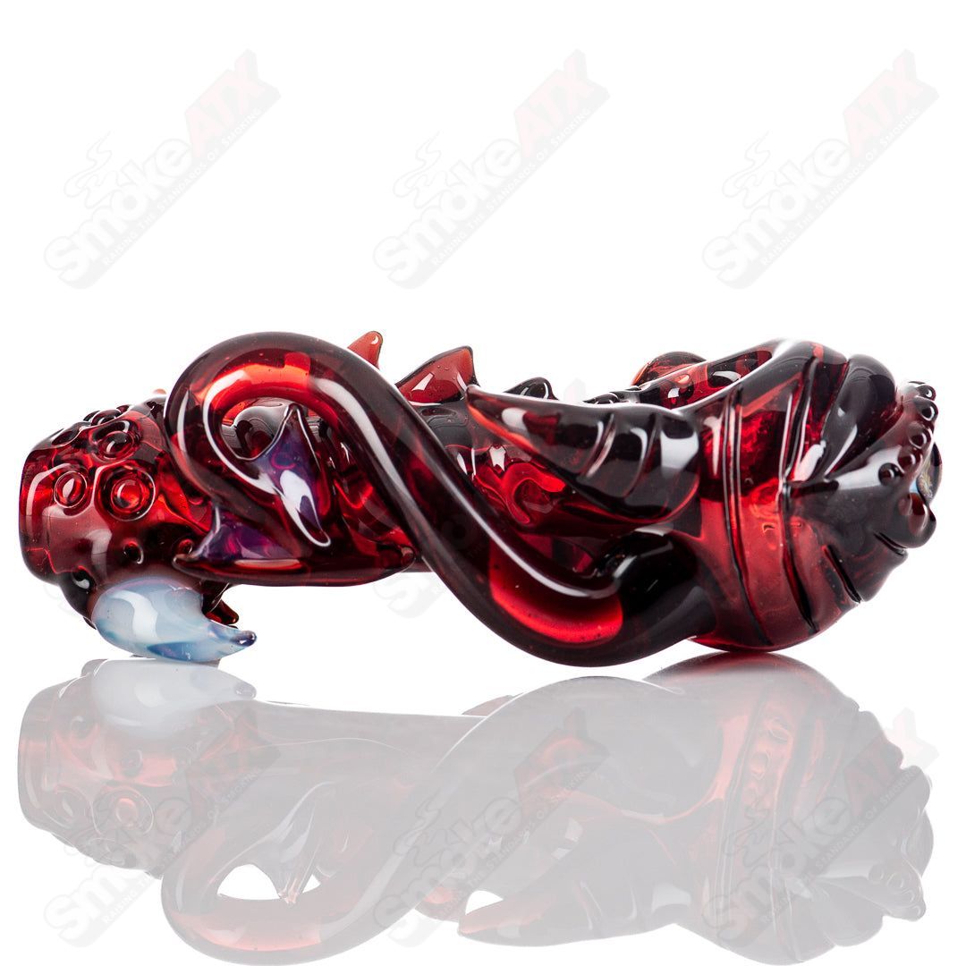 Handcrafted Mako Glass #5 Seamonster spoon pipe, colorful heady glass hand pipe with intricate sea monster design.