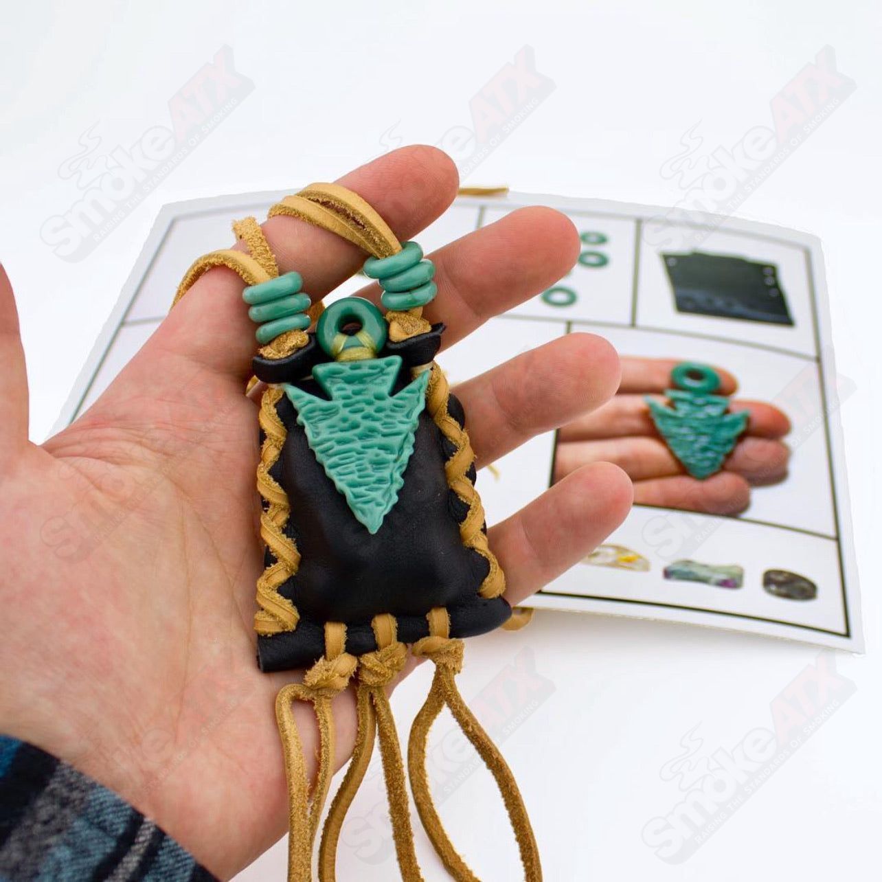 Elks That Run Arrowhead Medicine Bag featuring traditional design and leather strap, used for carrying small personal or spiritual items.