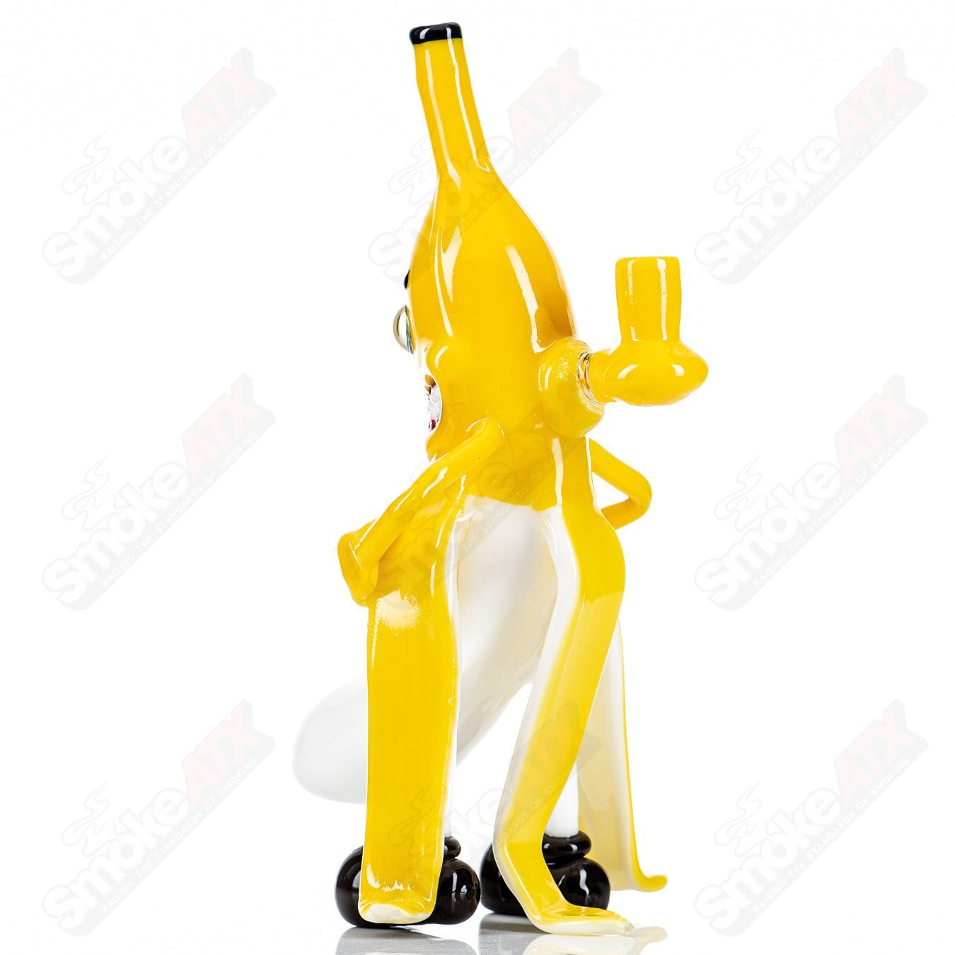 Hendy Banana Rig Heady Glass concentrate rig with yellow banana-shaped design and clear glass accents.