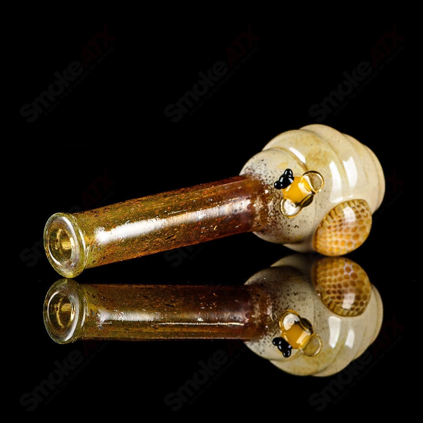 Joe P Glass Beehive Honeycomb Chillum, a colorful heady glass chillum with intricate honeycomb design and vibrant glasswork.