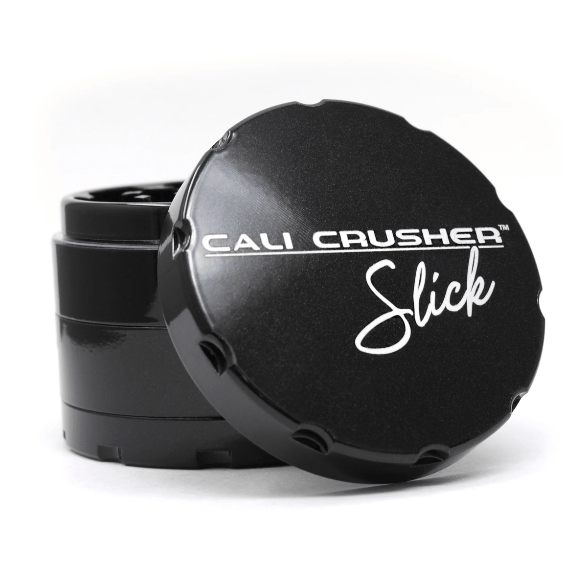 Black 2.5-inch Cali Crusher 4-piece metal grinder for herbs and spices, featuring a sleek design and durable construction.