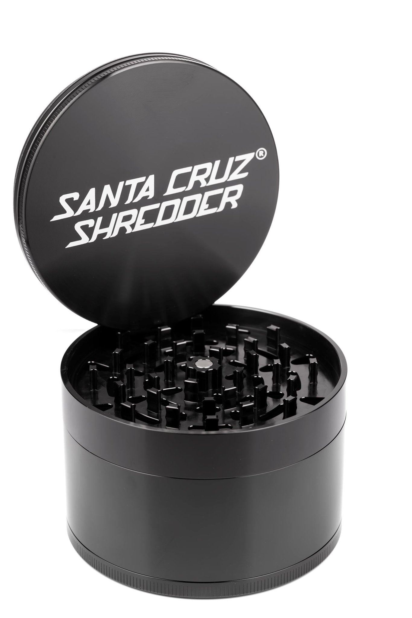 Black 4-piece Jumbo SCS grinder by Santa Cruz Shredder with metal construction and multiple compartments for grinding herbs.