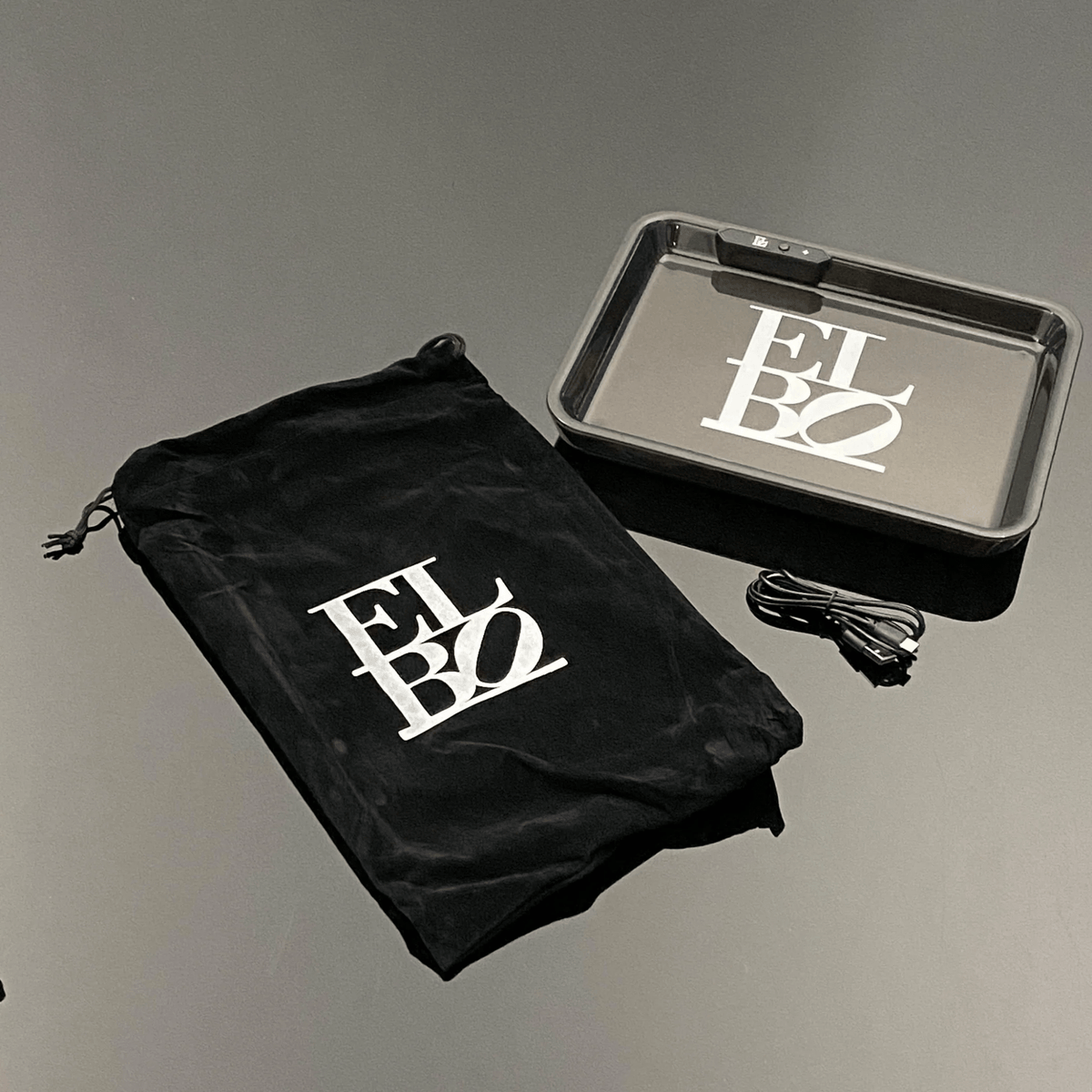 Black LED Elbo Glass rolling tray with illuminated surface, designed for 420 products and rolling accessories.