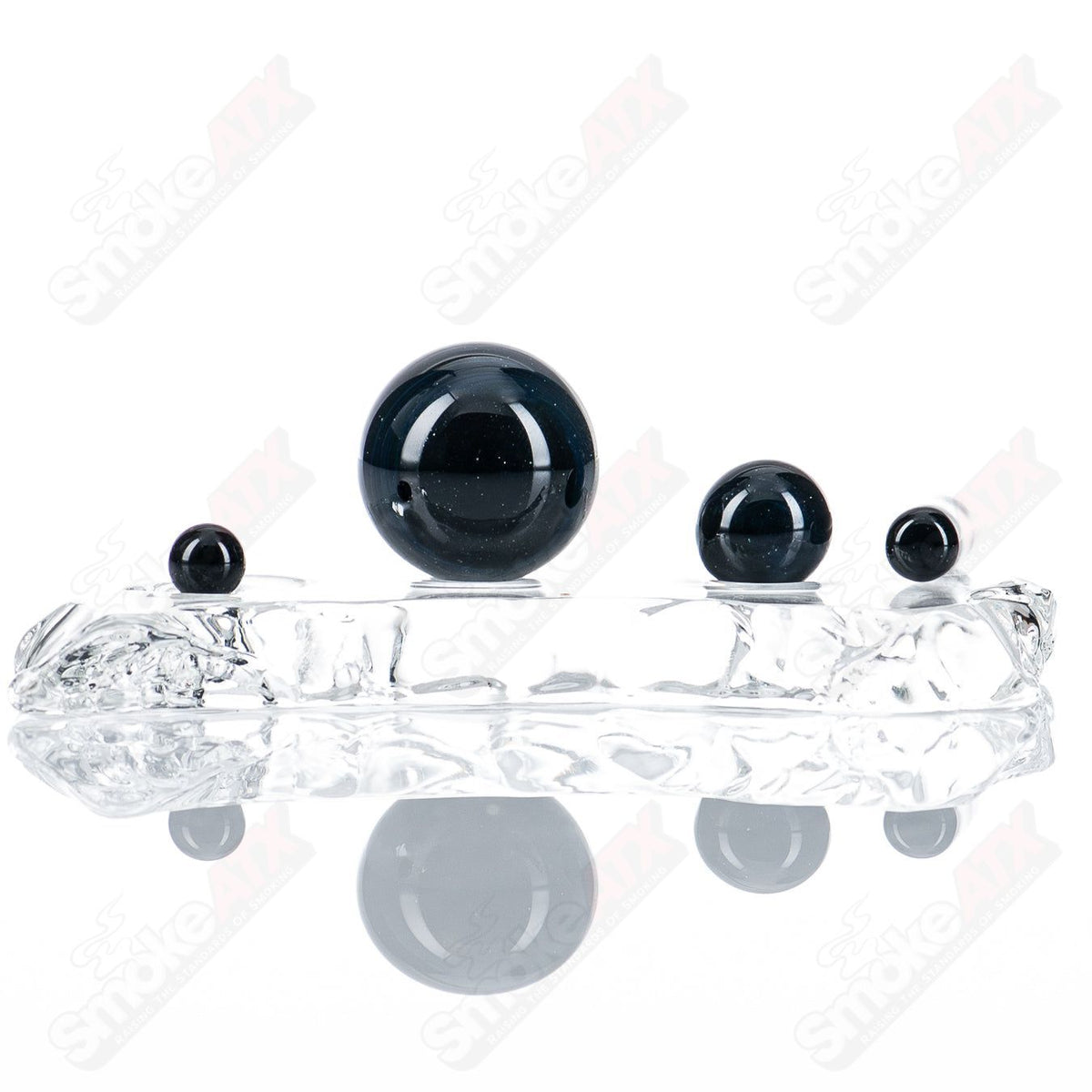 Black Magic Slurper Set from Indo Glass featuring glass dab tools with black handles and multiple tools for concentrates.