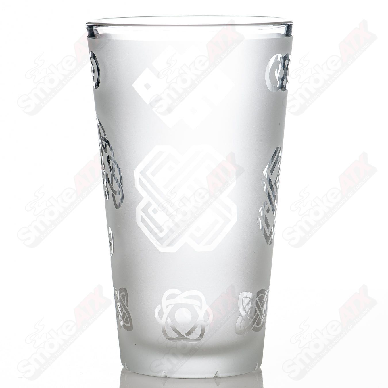 Heady glass pint glass with blasted ancient patterns by Fatal Facets, featuring intricate etched designs and a sturdy base.