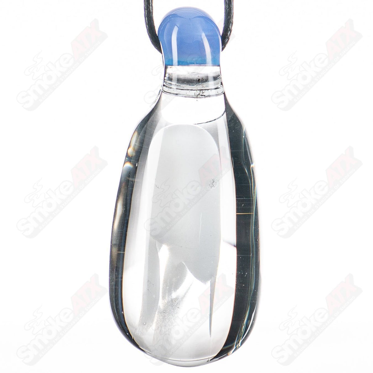 Blue glass pendant featuring a ghostly implosion design by Stoney Chicken, styled as a unique accent piece.