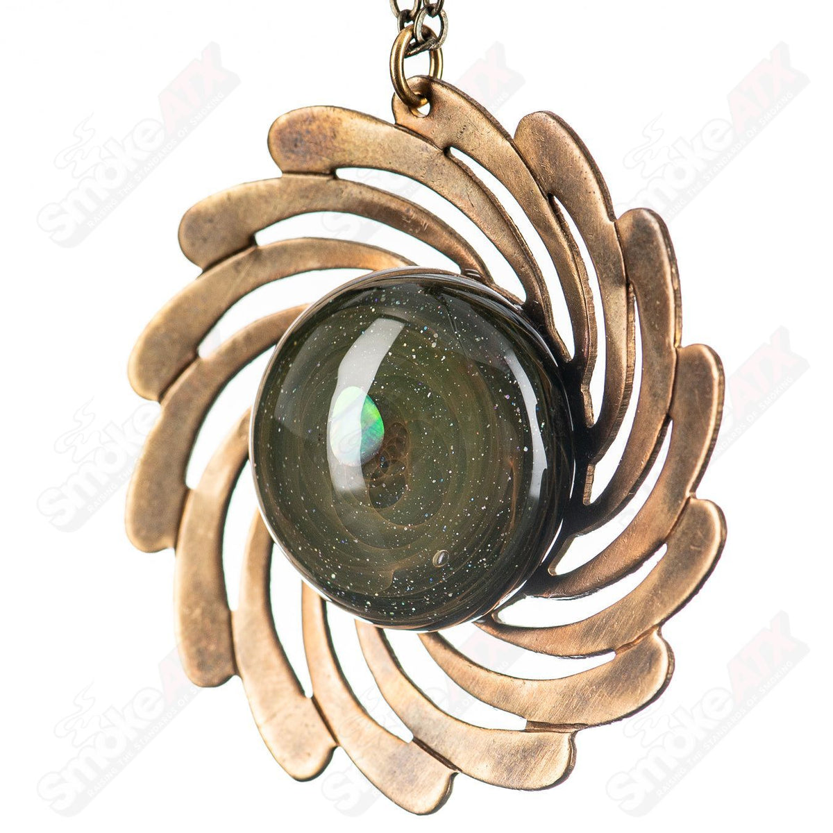 Glass pendant necklace featuring a brass disk pendant on a chain, by Pake, with a sleek and modern design.