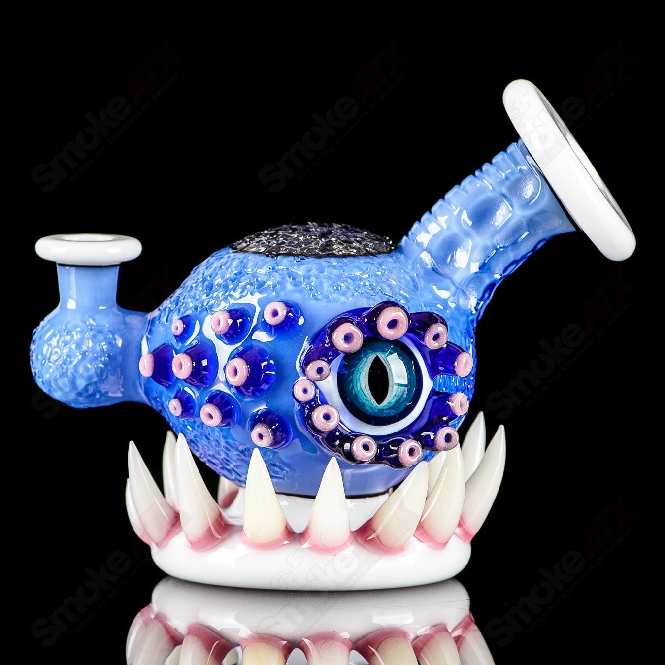 Brilliant blue Orb Rig by Salt & JAG, a heady glass concentrate rig with a spherical design and vibrant blue color.