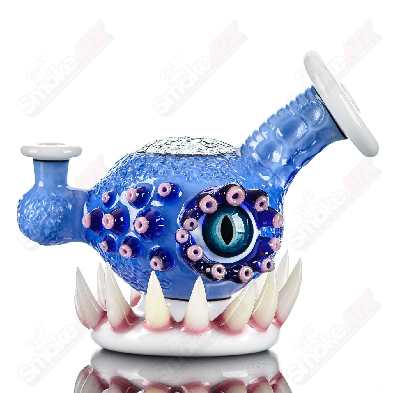 Brilliant blue ORB rig by SALT & JAG, a heady glass concentrate rig with vibrant blue glass and intricate design details.