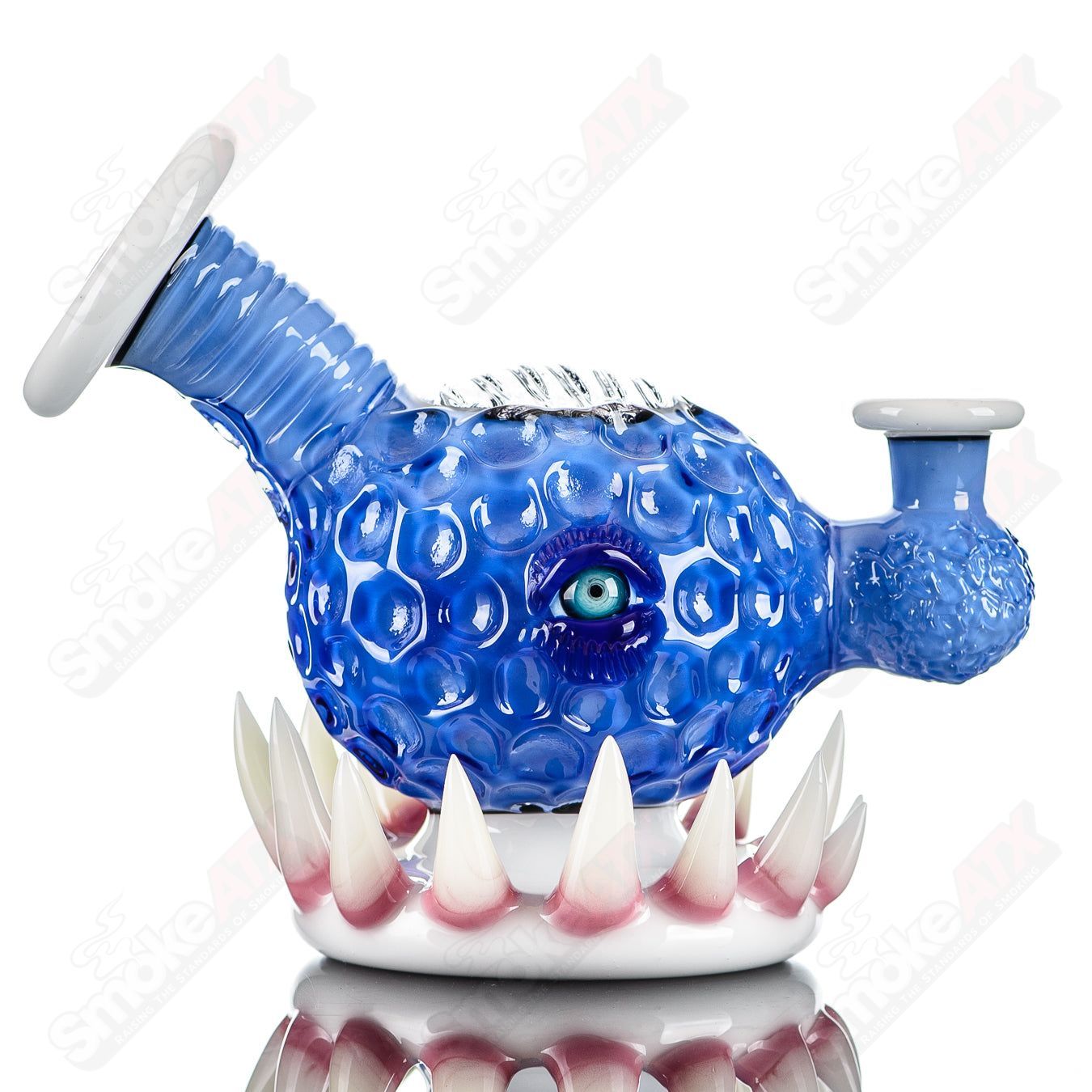 Bright blue ORB rig by Salt & JAG, a heady glass concentrate rig with intricate design and clear glass accents.