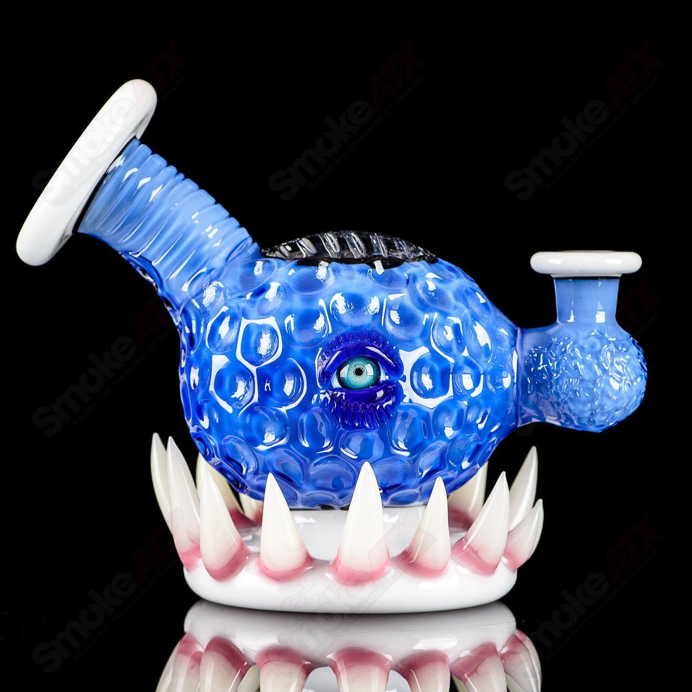 Brilliant blue orb concentrate rig by Salt Glass, heady glass rig with intricate design and smooth glass finish.
