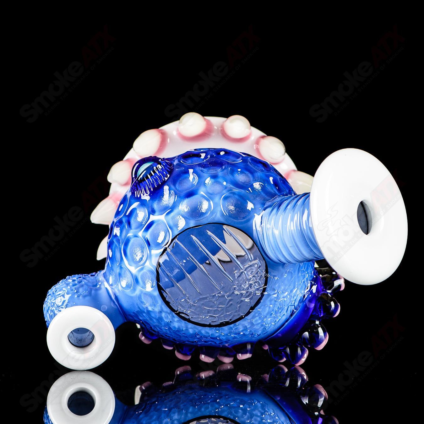 Brilliant blue Orb Rig by Salt & JAG, a colorful heady glass concentrate rig with intricate glasswork and spherical design.