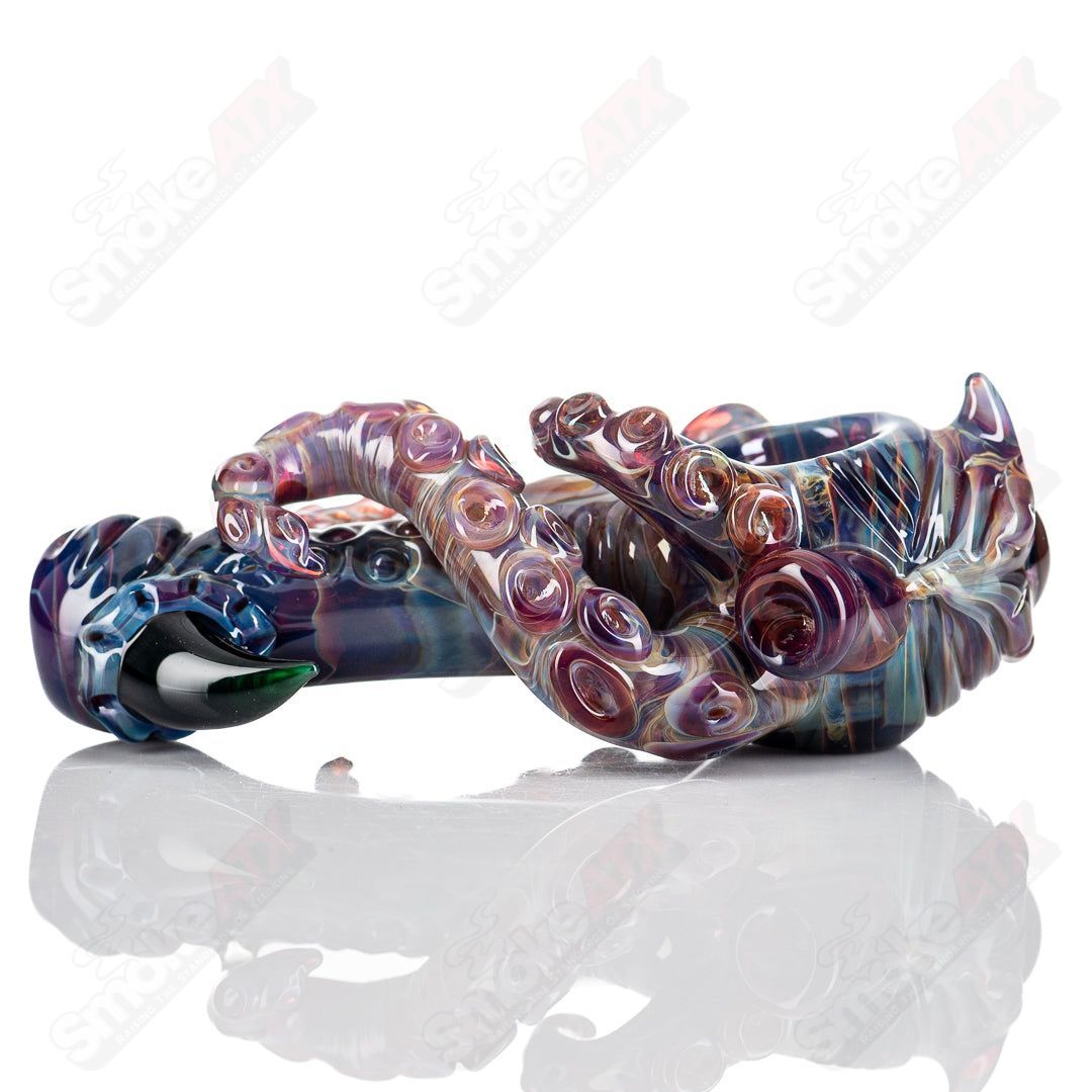 Black and white Seamonster hand pipe by Mako Glass, featuring intricate glasswork in a heady glass design.