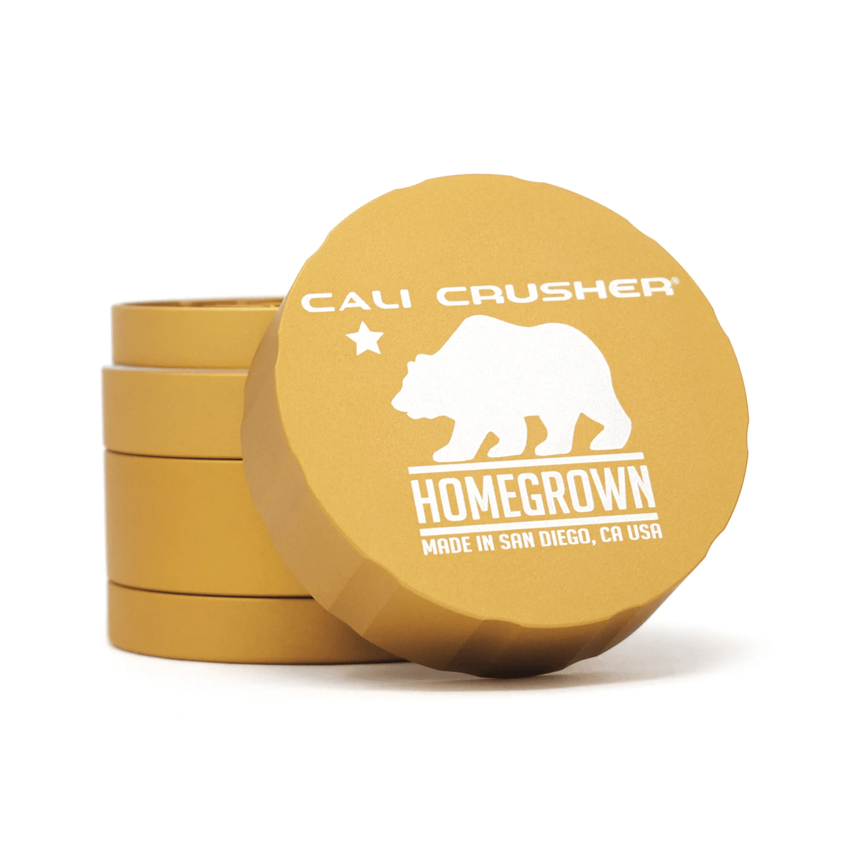 Cali Crusher 4-piece Homegrown Gold metal grinder for herbs with gold finish and multiple compartments for grinding and storage
