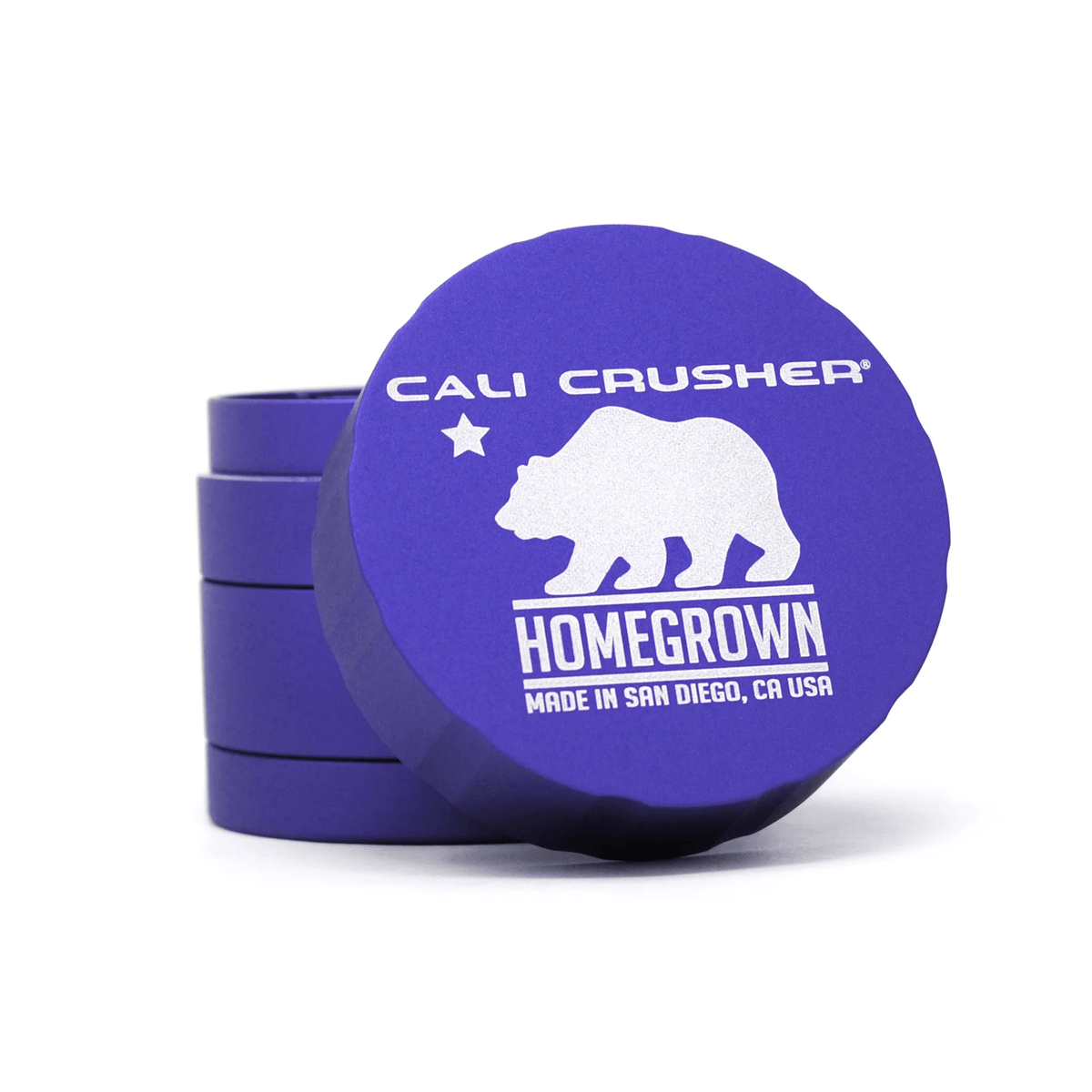 Cali Crusher 4-piece Homegrown Purple metal grinder with textured grip and multiple chambers for grinding and storage.