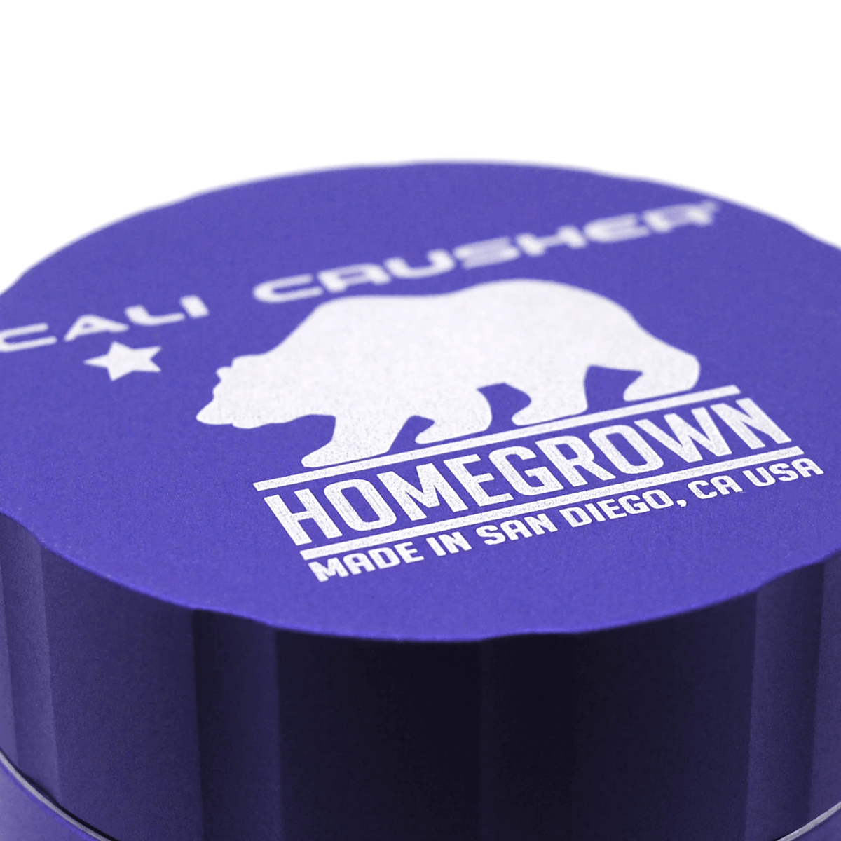 Cali Crusher 4-piece Homegrown Purple metal grinder with multiple chambers for herb grinding and storage.