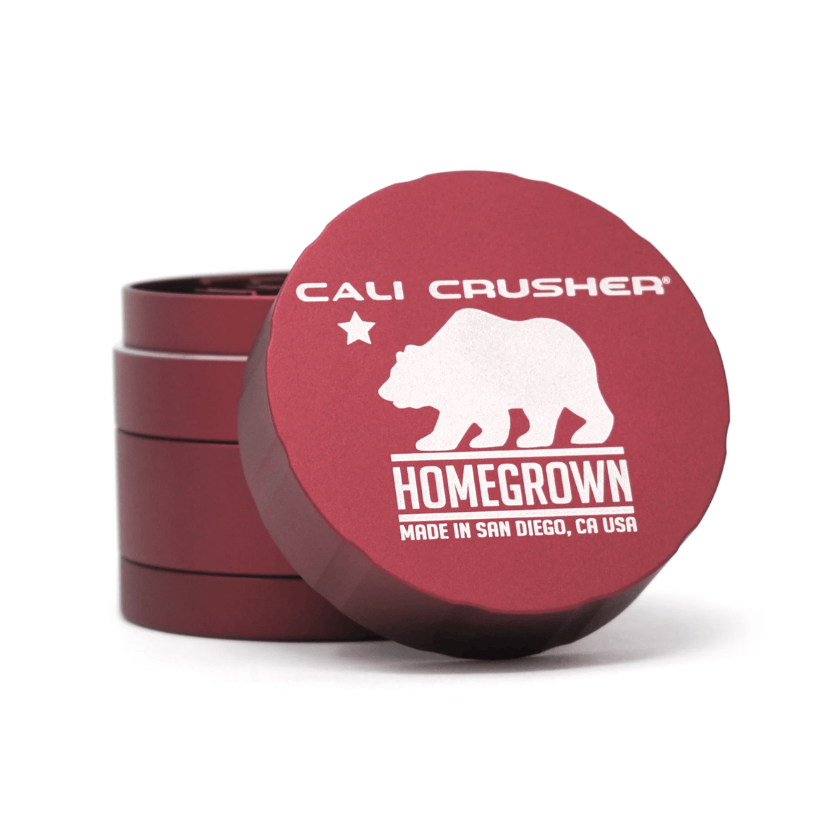 Cali Crusher 4-piece Homegrown Red metal grinder with sharp teeth and pollen catcher for herb grinding and collection.