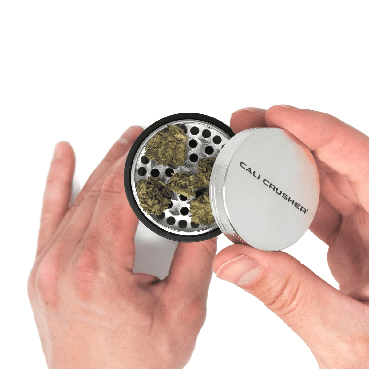 Cali Crusher Cali O.G. pre-roll grinder with metal construction and textured grip for easy grinding of cannabis pre-rolls.