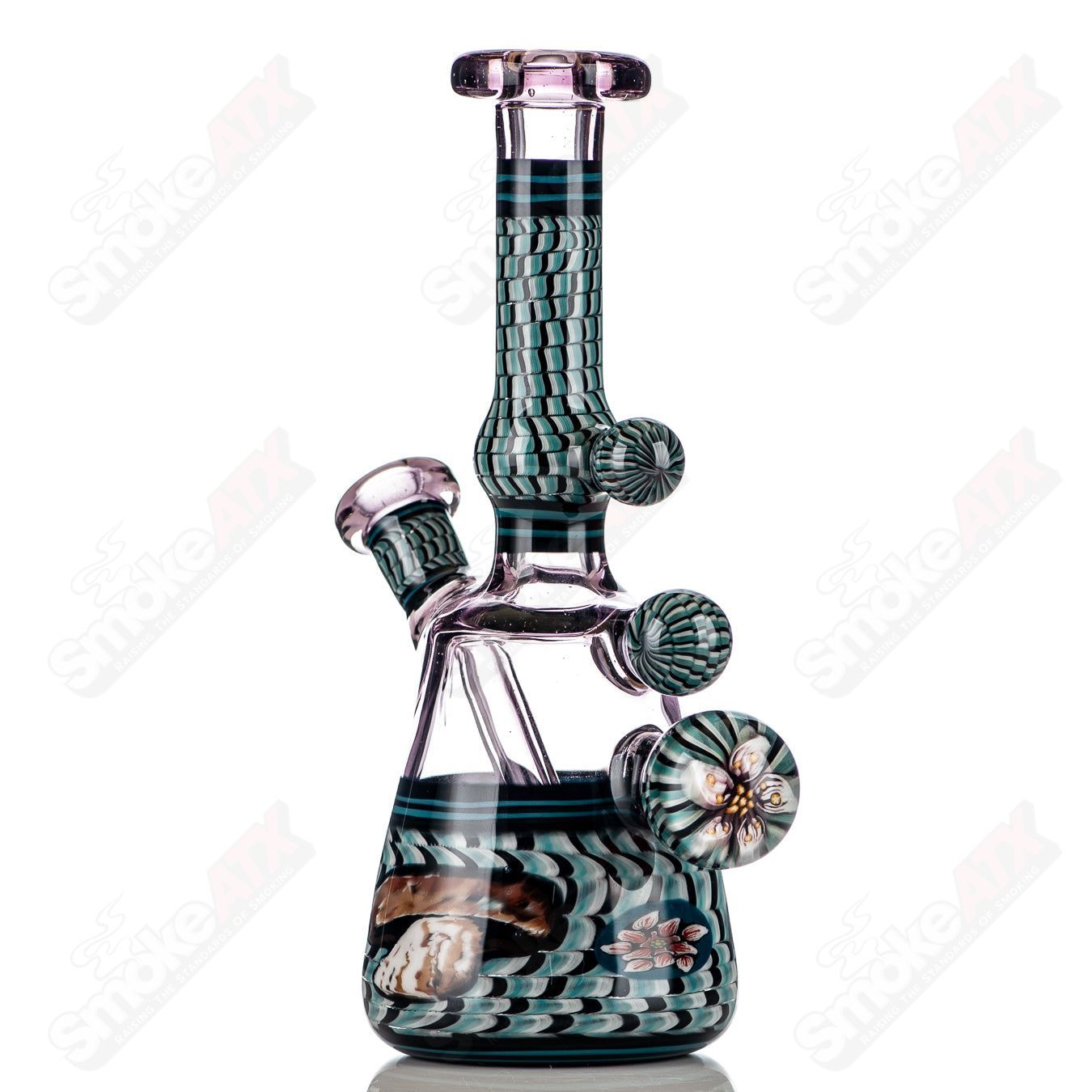 Coiled Latticello Milli Rig by Conversion Glass, a colorful heady glass concentrate rig with intricate coil design and clear glass accents.