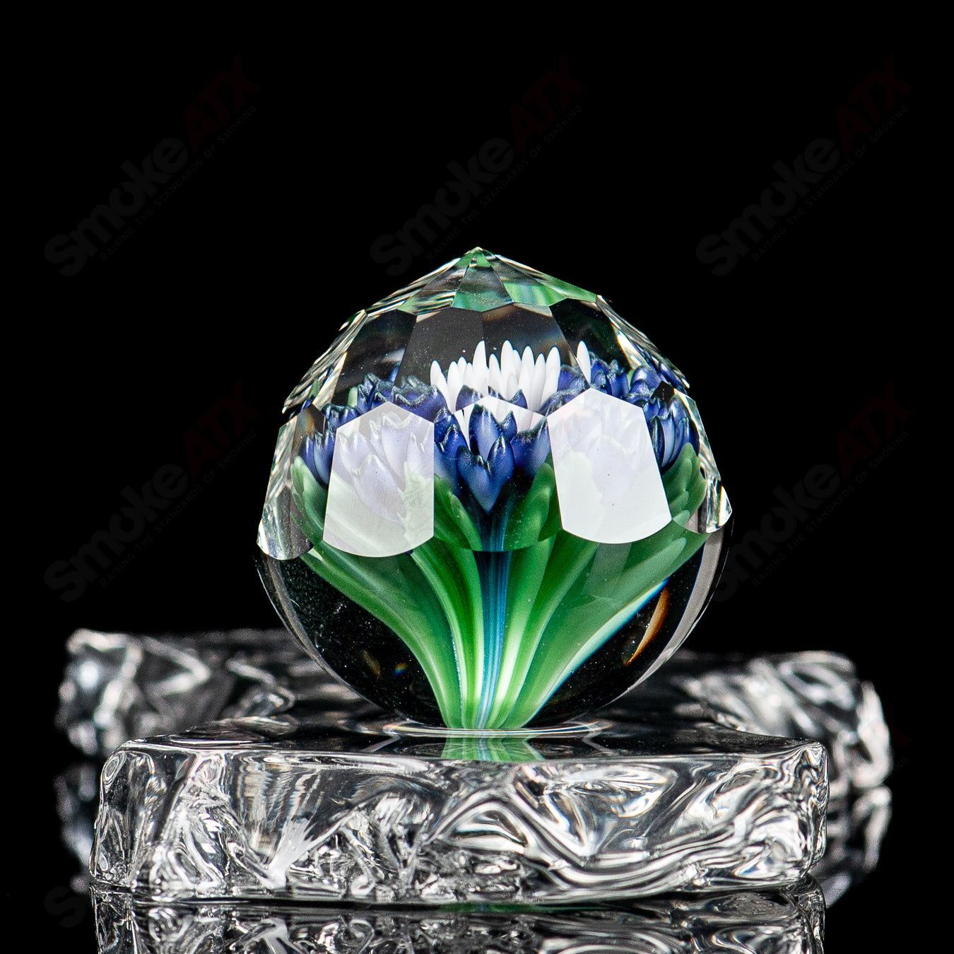 Colorful Flower Marble by Fatal Facets, glass impact marble with intricate floral design, part of Heady Glass marbles collection.