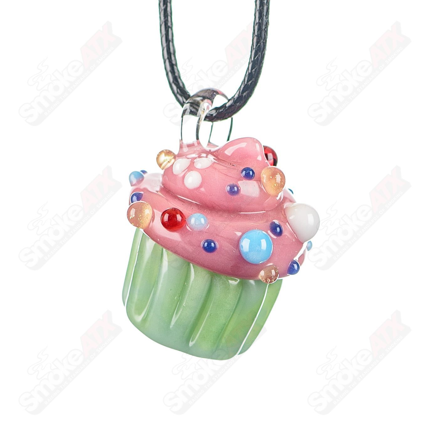 Glass cupcake pendant with mint wrapper, pink frosting, and multicolor sprinkles by Sweet Shop Glass, designed by Renee Patula.
